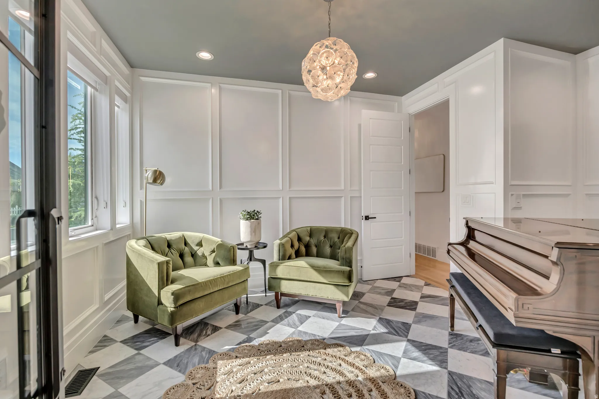 Living area featuring a decorative wall and recessed lighting