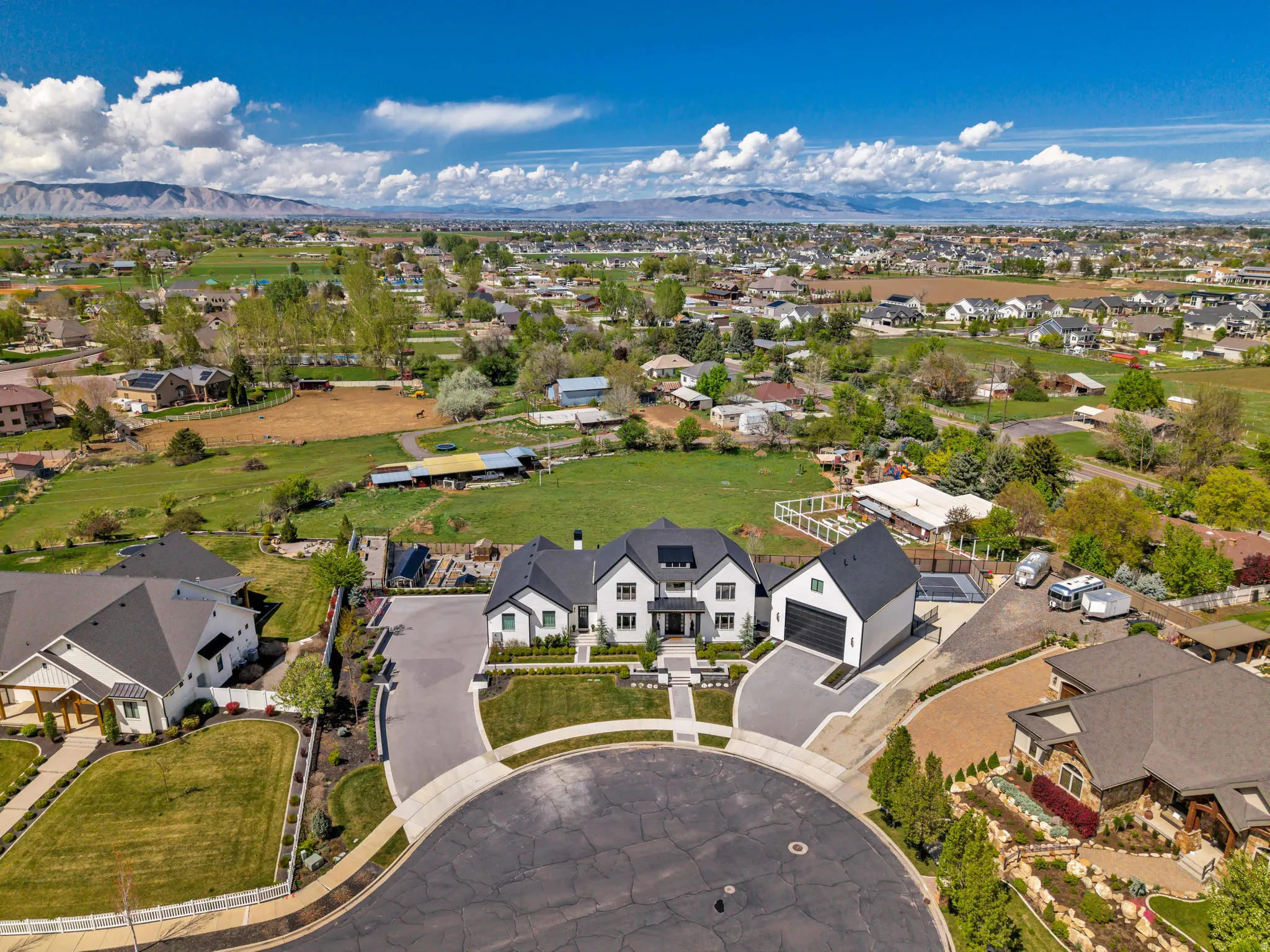 Aerial perspective of suburban area with a mountain backdrop