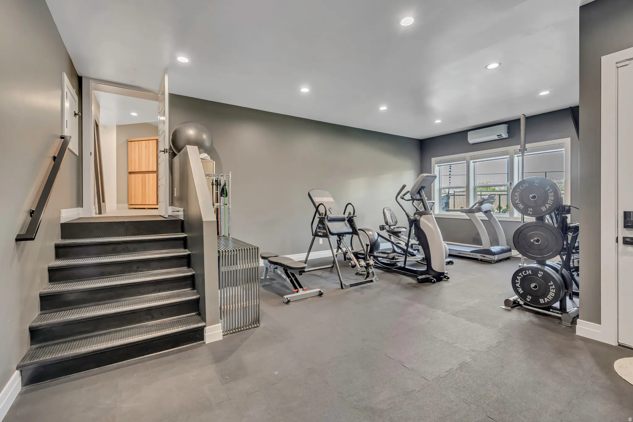 Gym featuring recessed lighting and arched walkways
