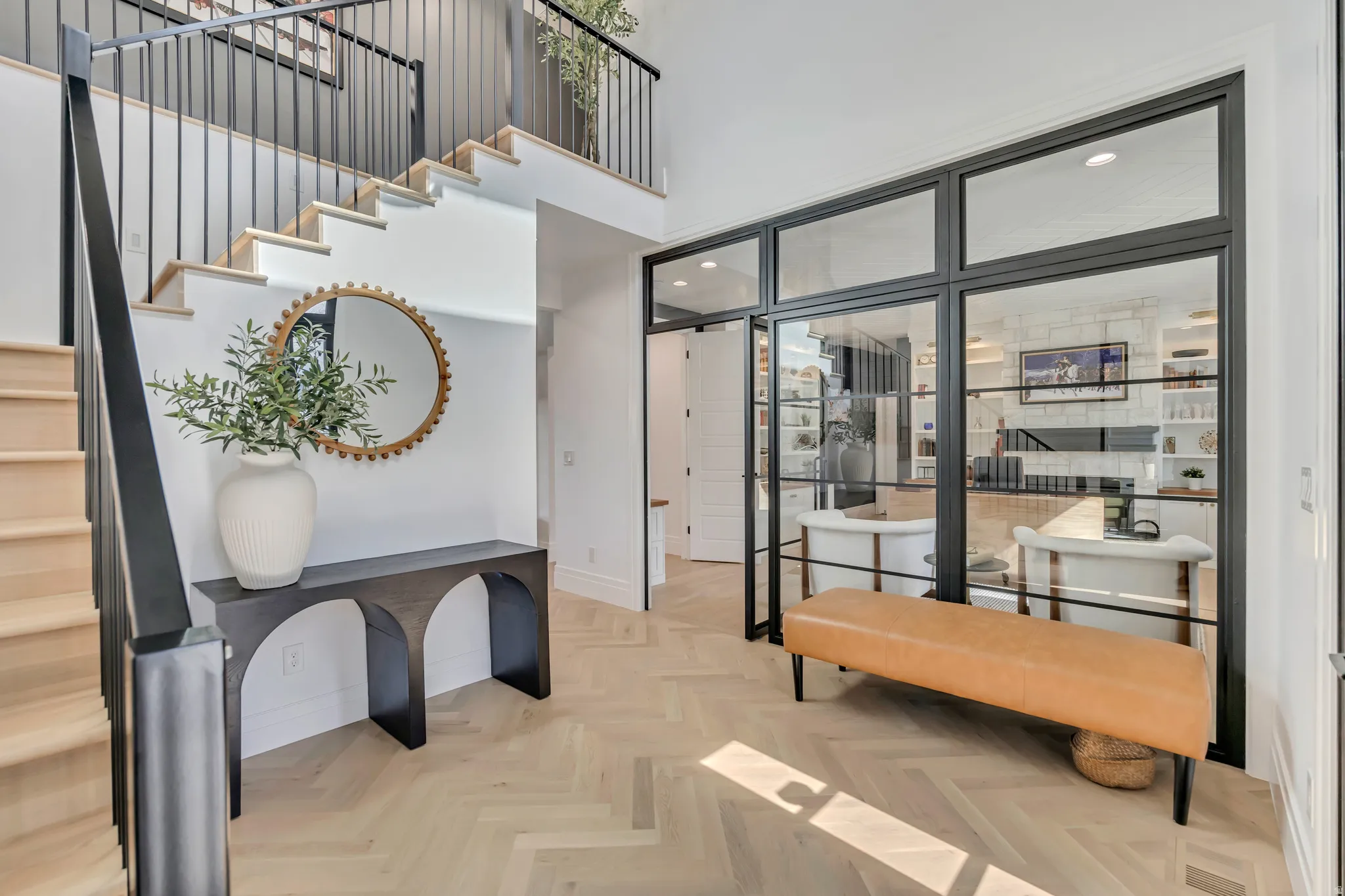 Entrance foyer with parquet flooring, recessed lighting, and a high ceiling