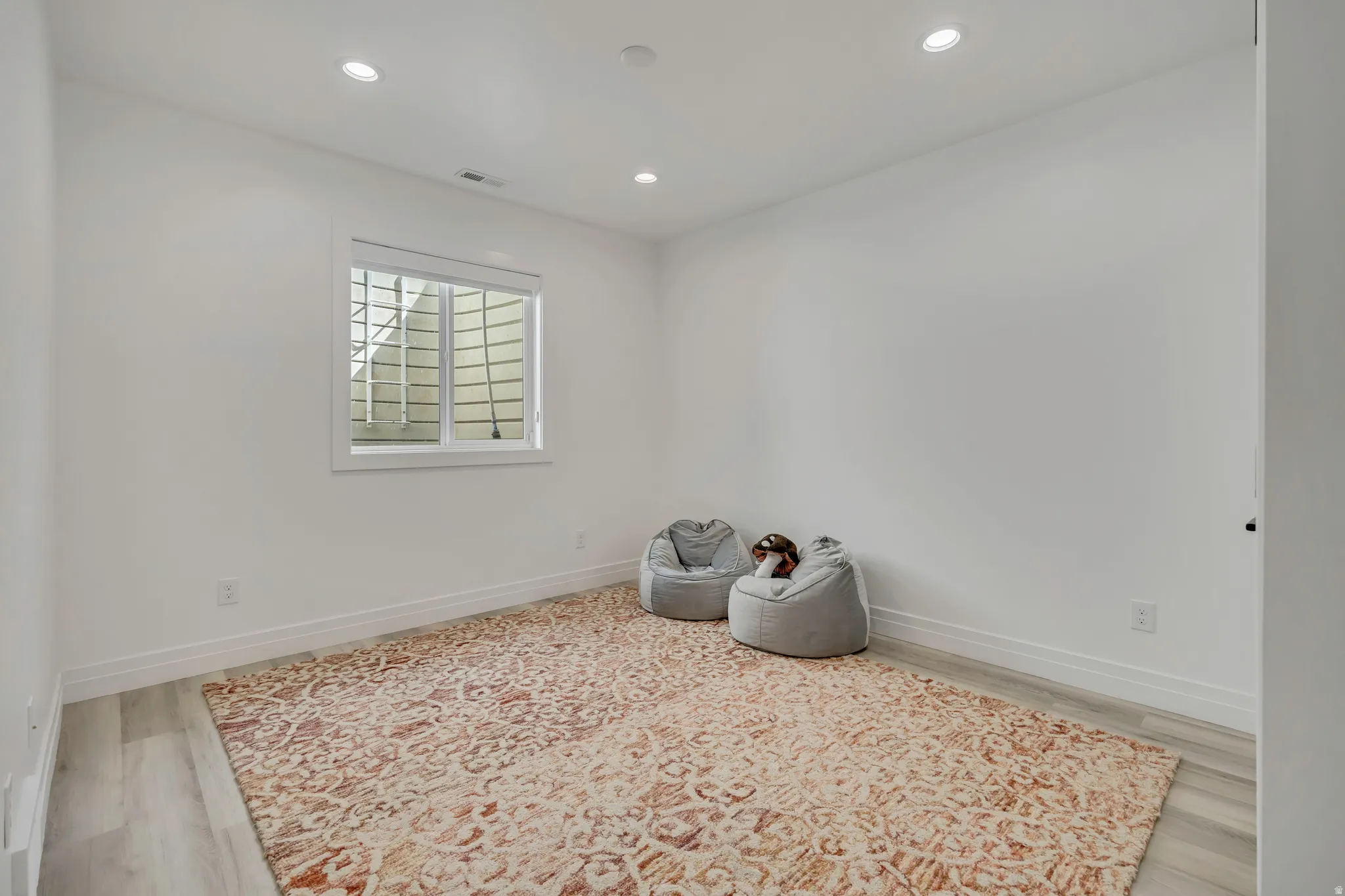 Unfurnished room featuring recessed lighting and light wood-style flooring