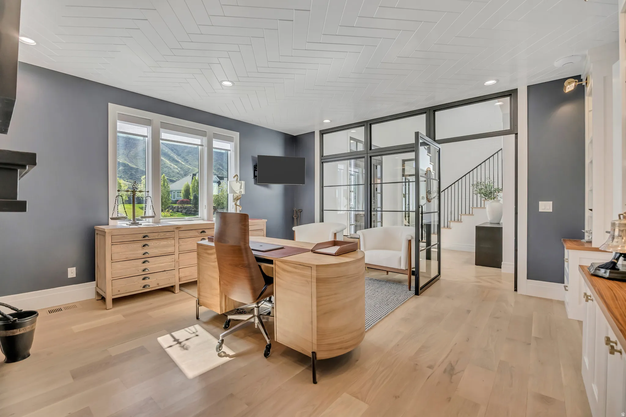 Office featuring light wood-type flooring and baseboards