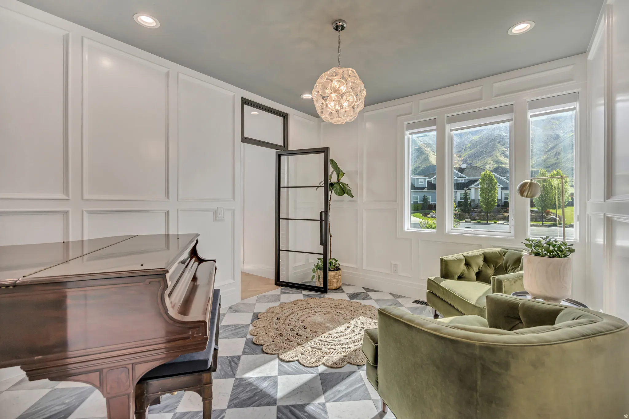 Office featuring a decorative wall and a chandelier