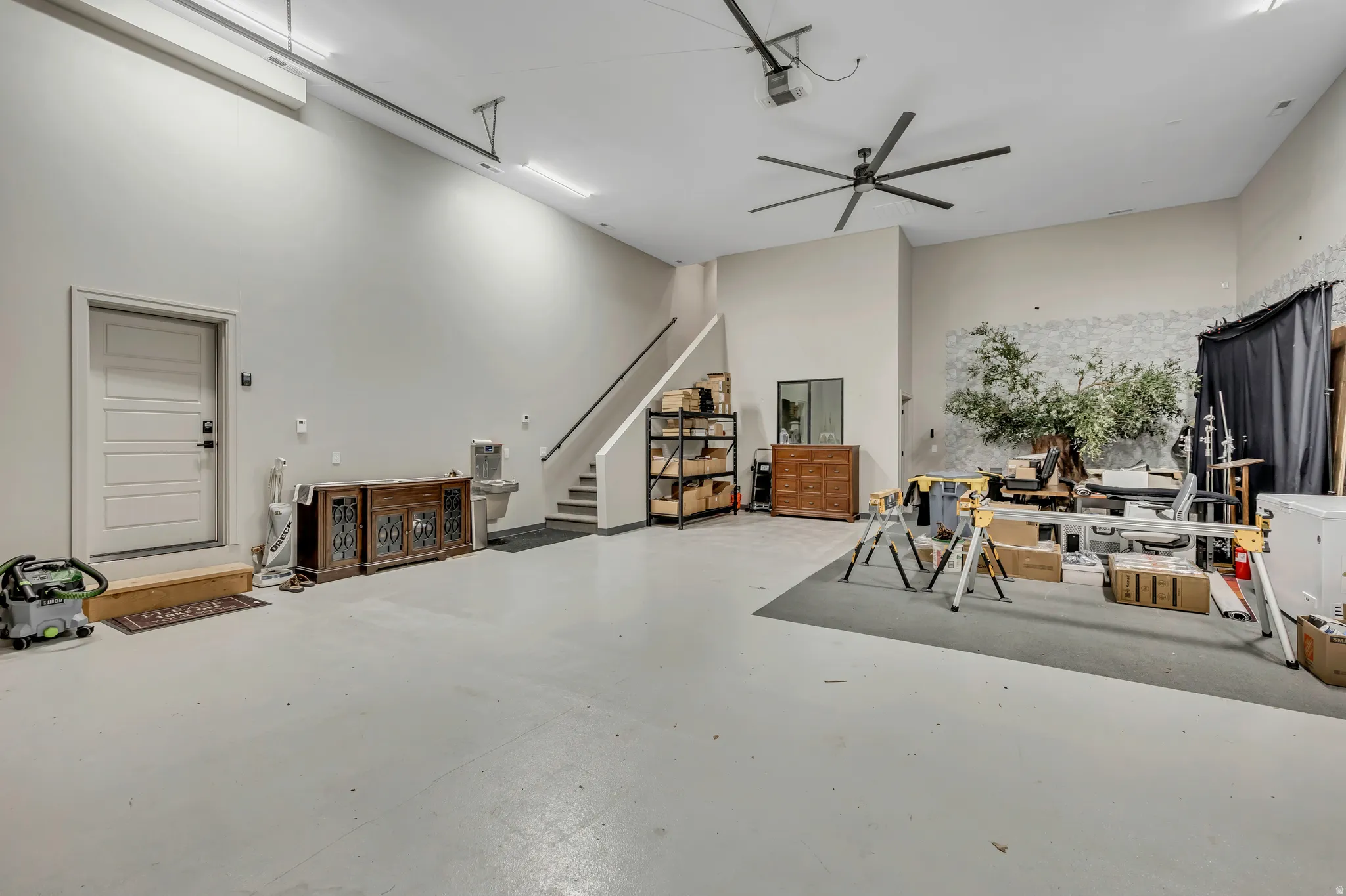 Garage featuring a ceiling fan