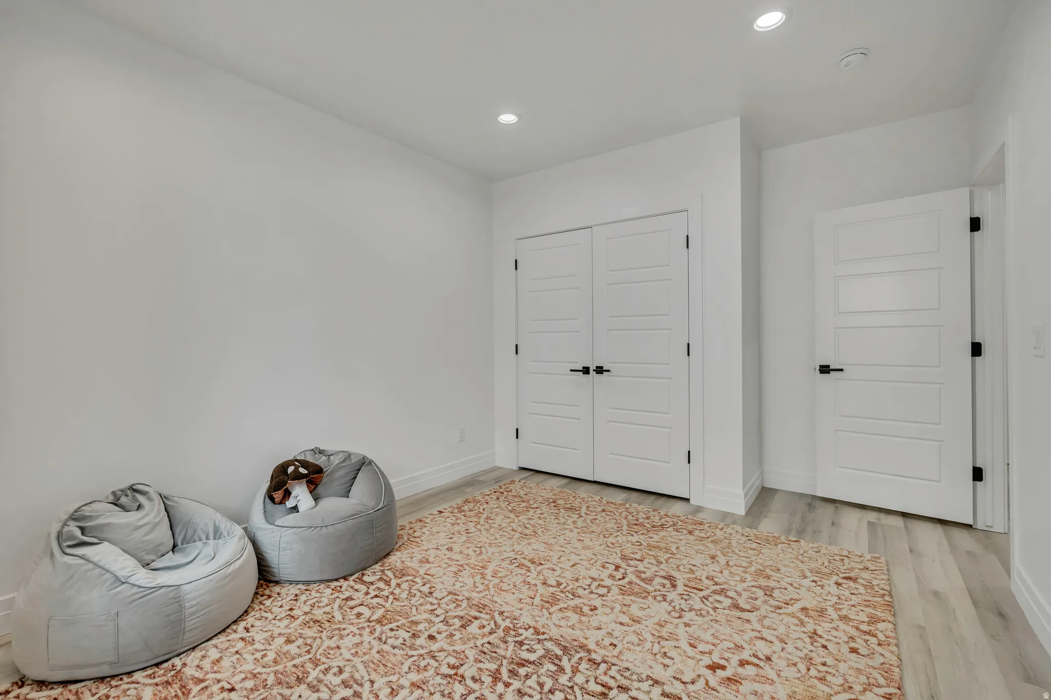 Misc room featuring recessed lighting and light wood-style flooring