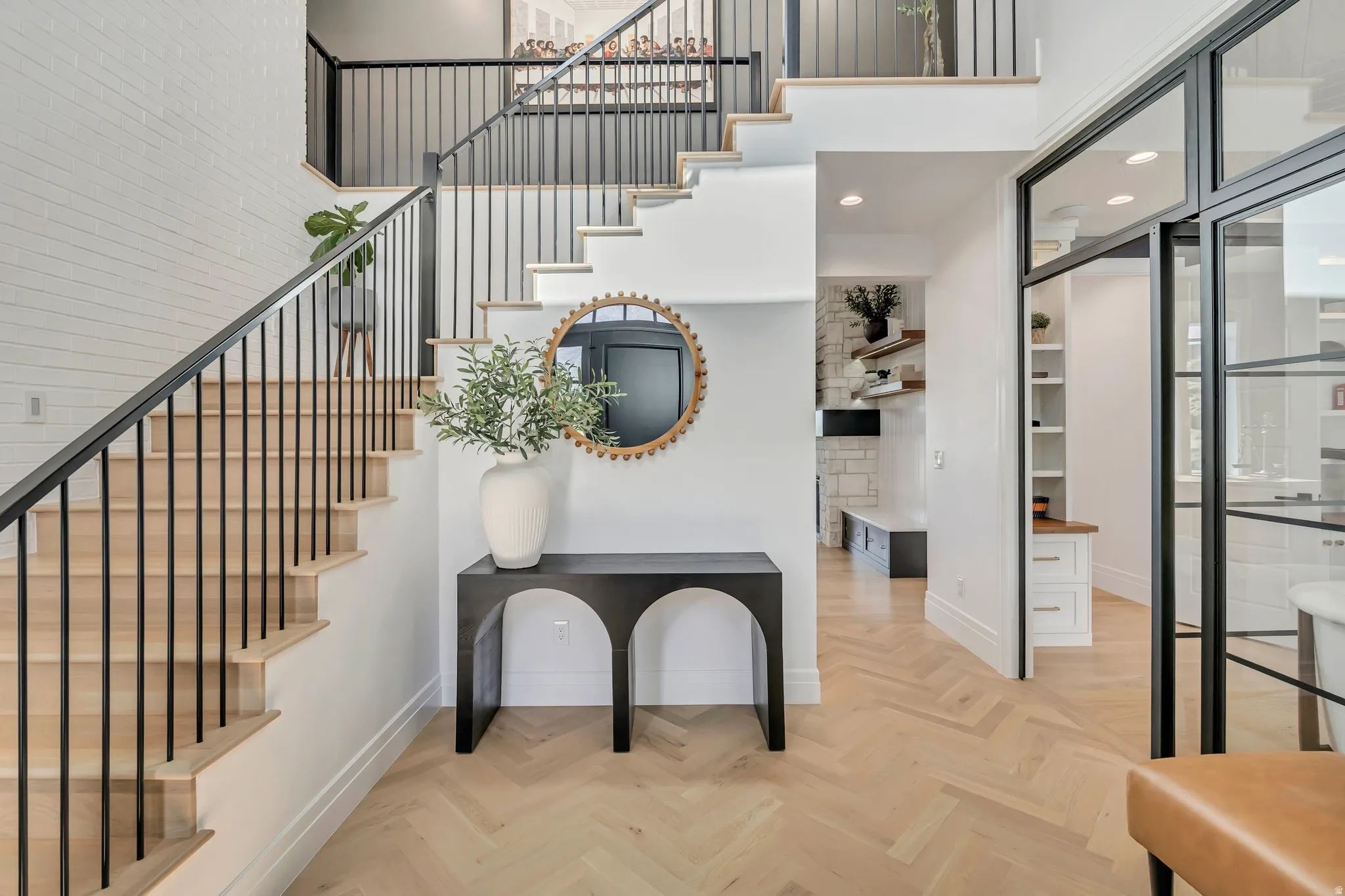 Stairs featuring parquet flooring, a high ceiling, and recessed lighting