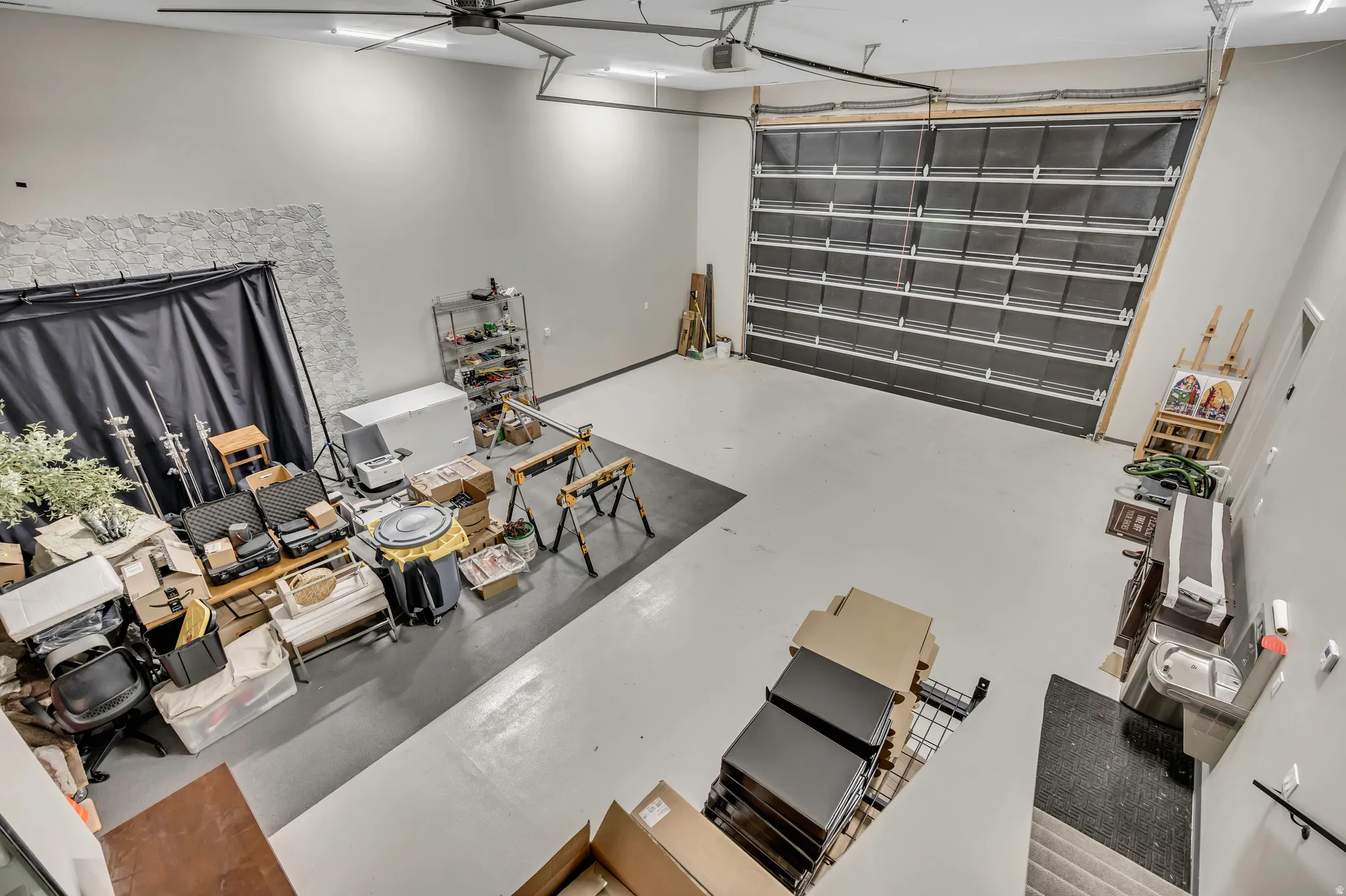 Living room with finished concrete floors and a garage