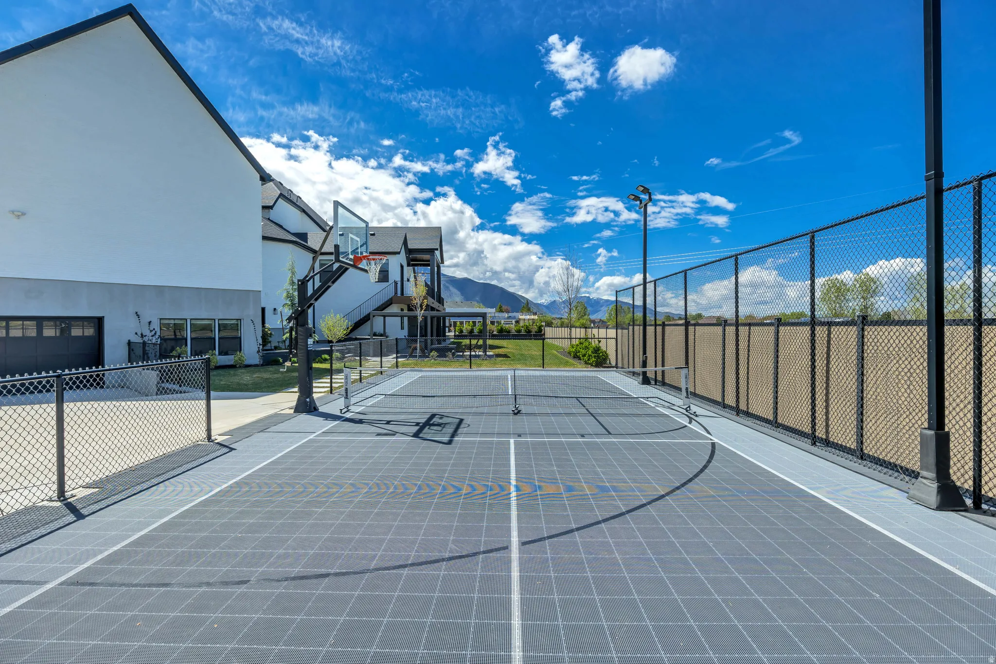 View of basketball court featuring a mountain view and community basketball court
