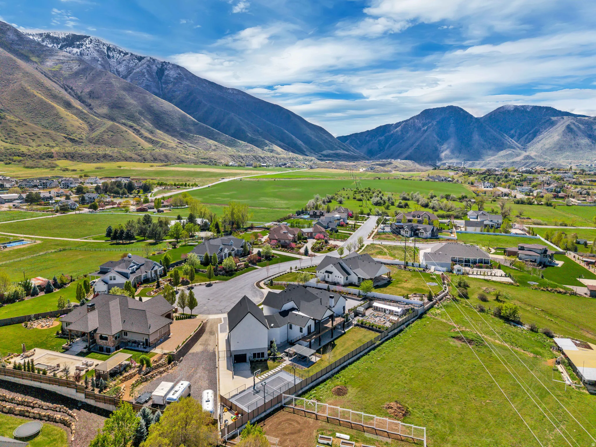 Aerial perspective of suburban area featuring a mountainous background