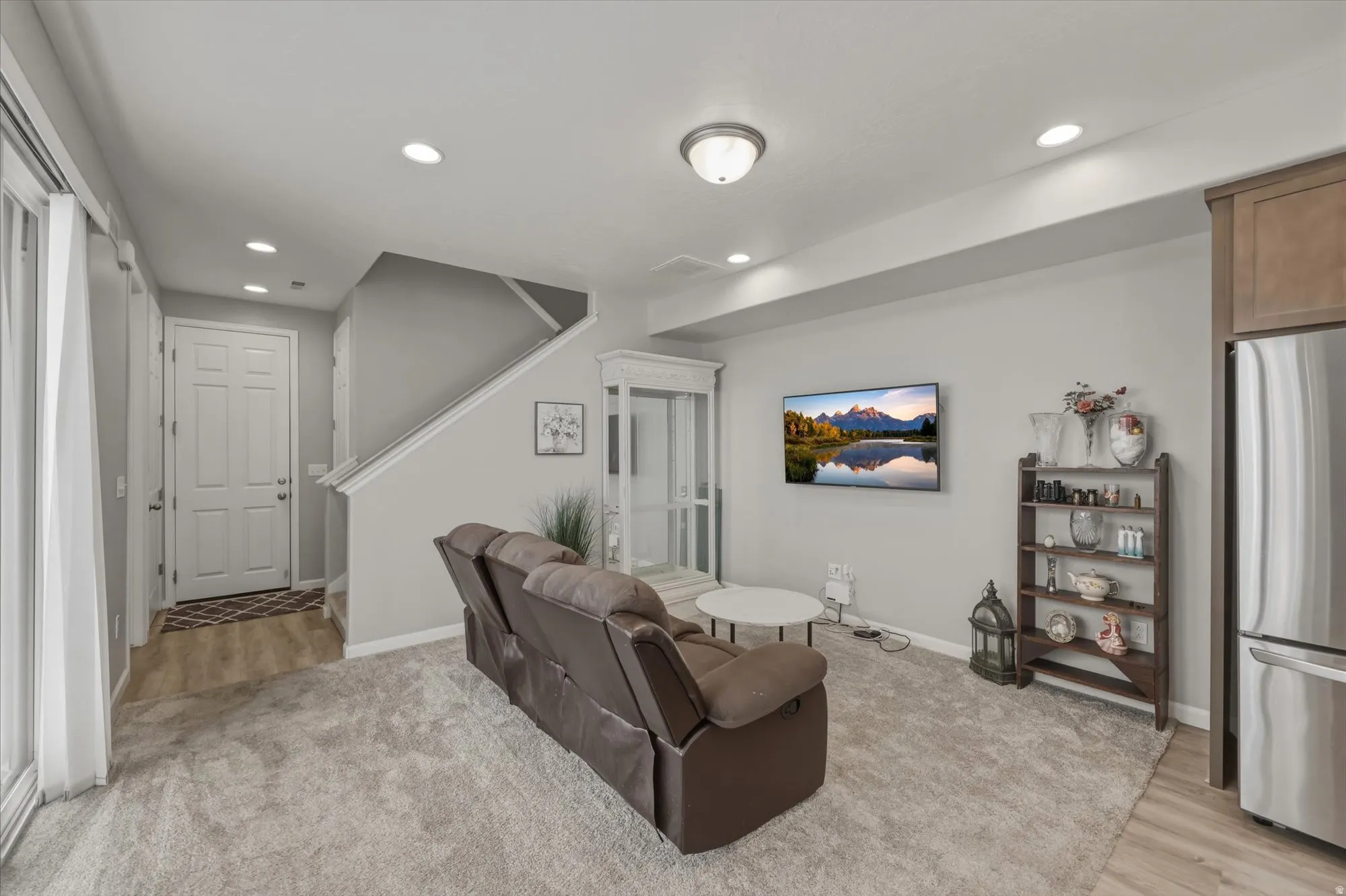 Living area featuring recessed lighting and baseboards