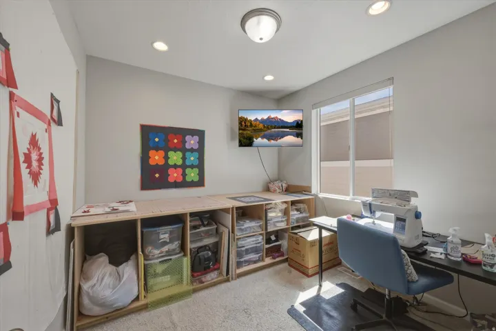 Office space featuring light colored carpet and recessed lighting