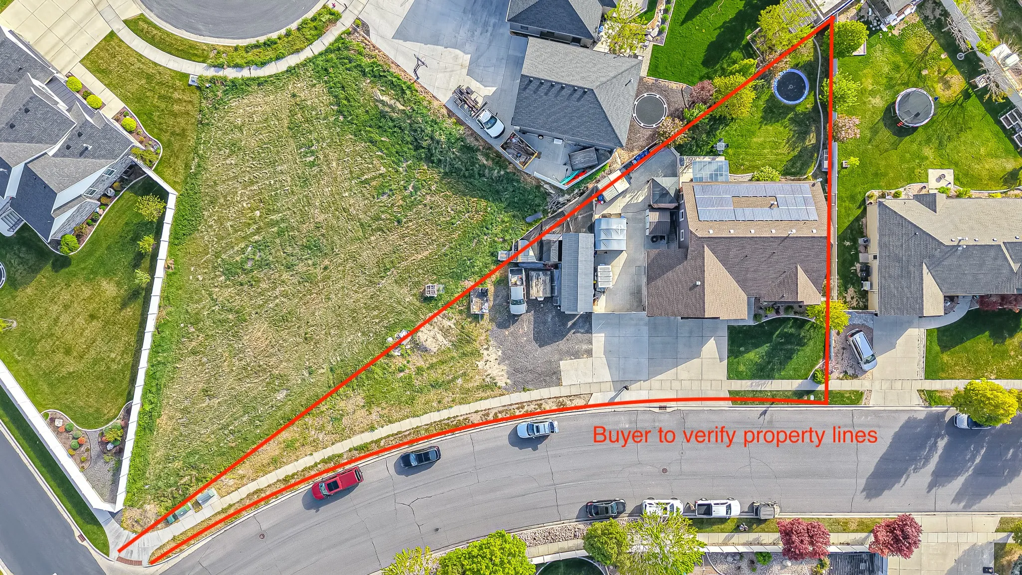 Aerial perspective of suburban area with property boundaries highlighted