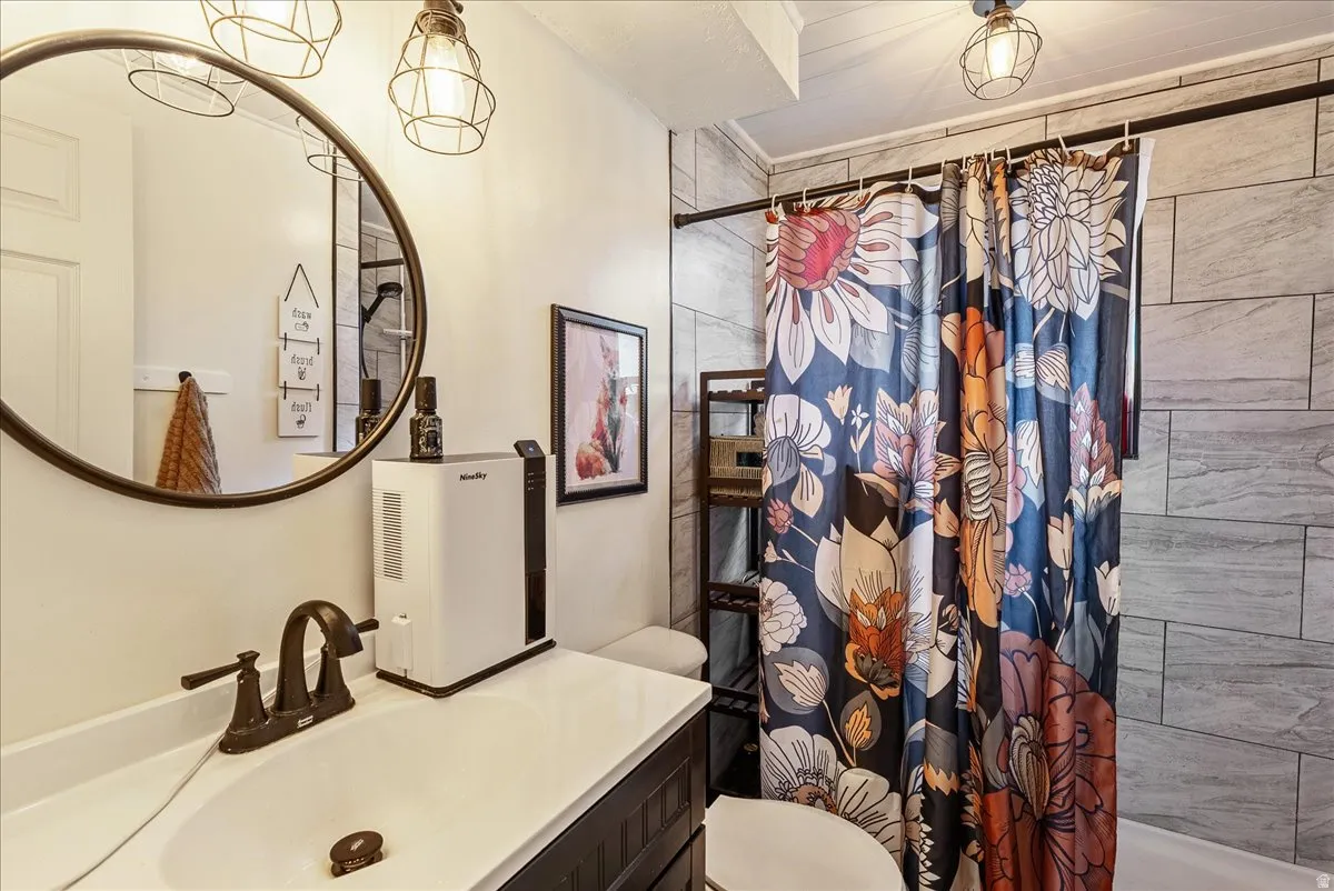 Bathroom with a tile shower and vanity