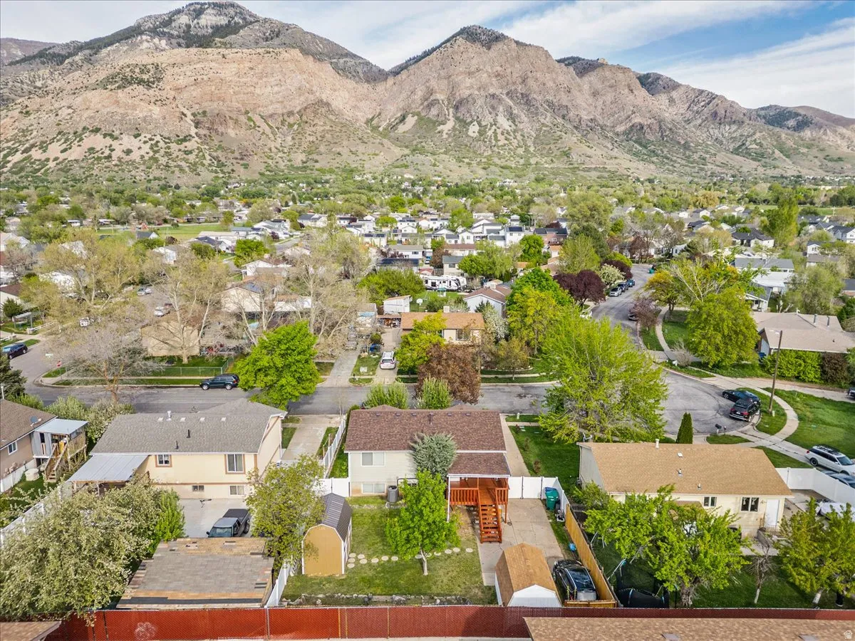 Aerial perspective of suburban area featuring a mountain backdrop