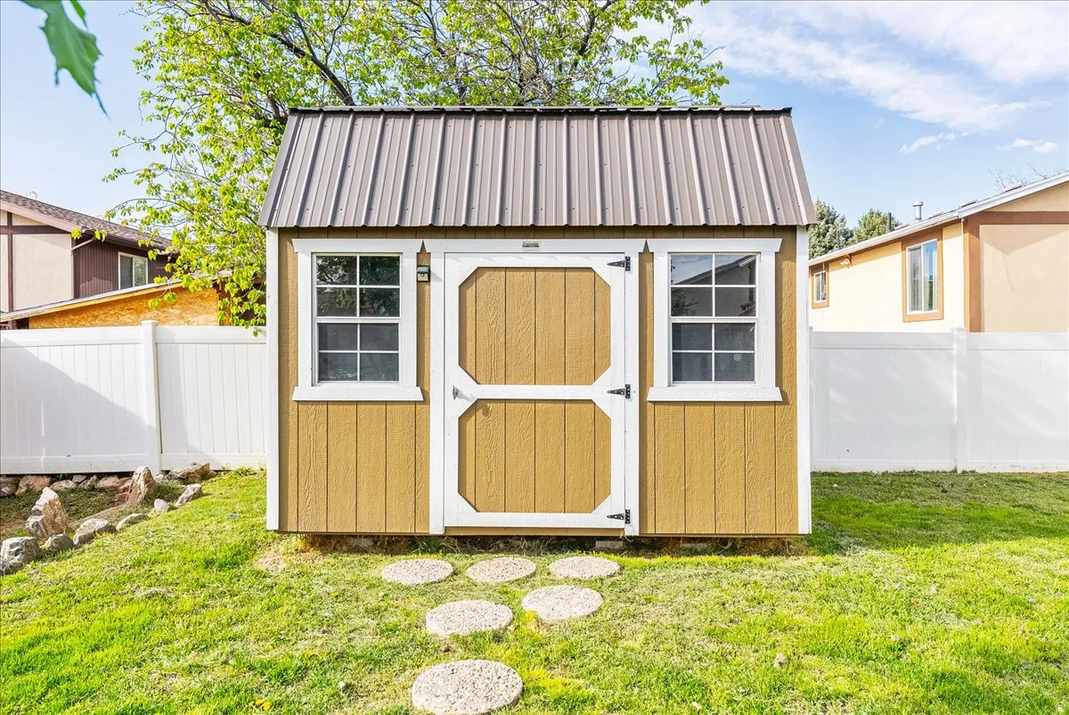 View of shed featuring a fenced backyard