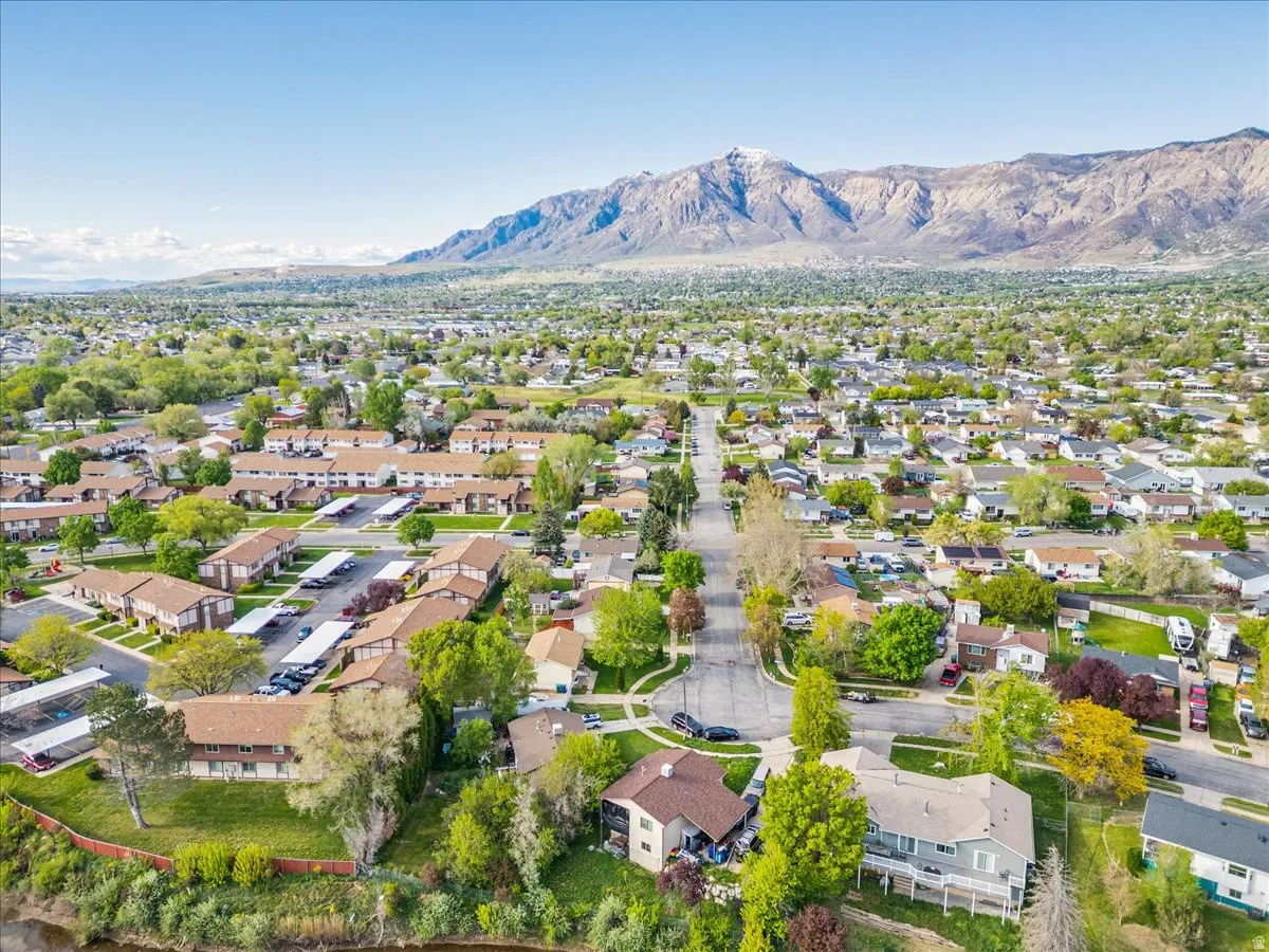Aerial perspective of suburban area with a mountain backdrop