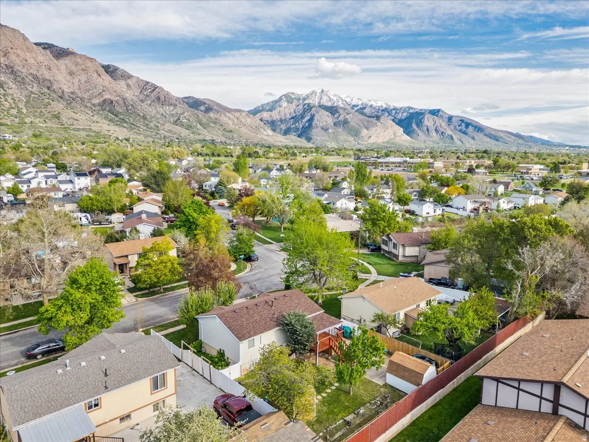 Aerial perspective of suburban area with a mountainous background