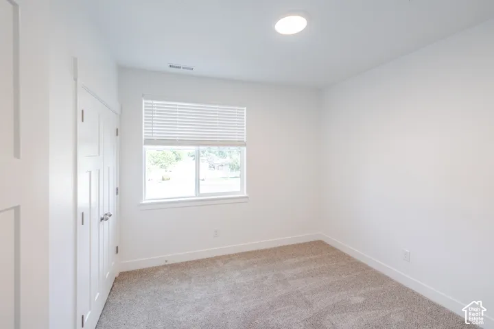 Recessed lighting with a window featuring horizontal blinds