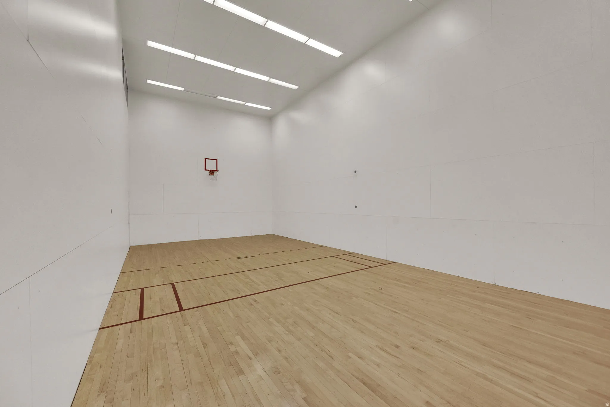 Surrounding community featuring a sport court and community basketball court