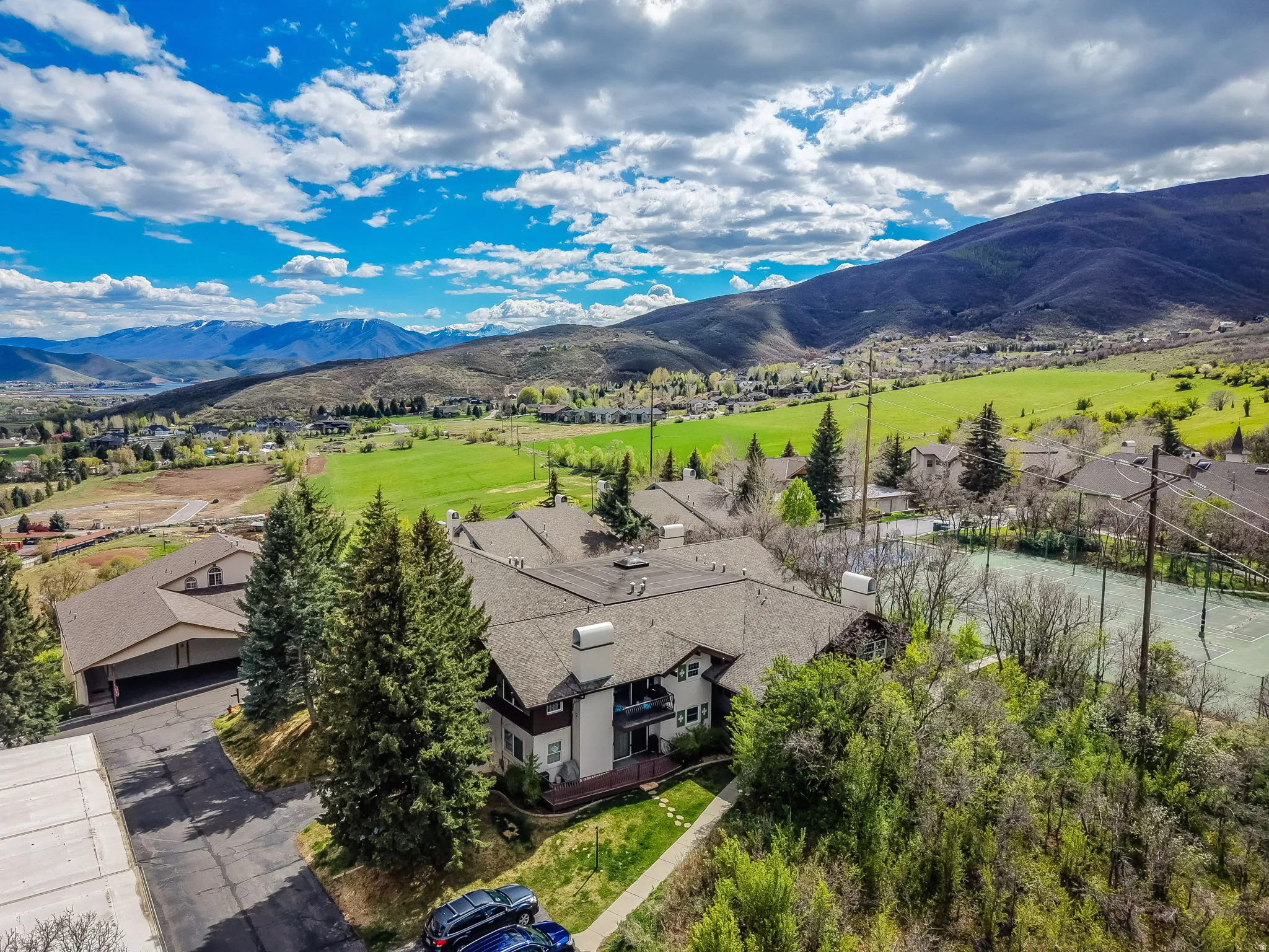Aerial perspective of suburban area with a mountain backdrop