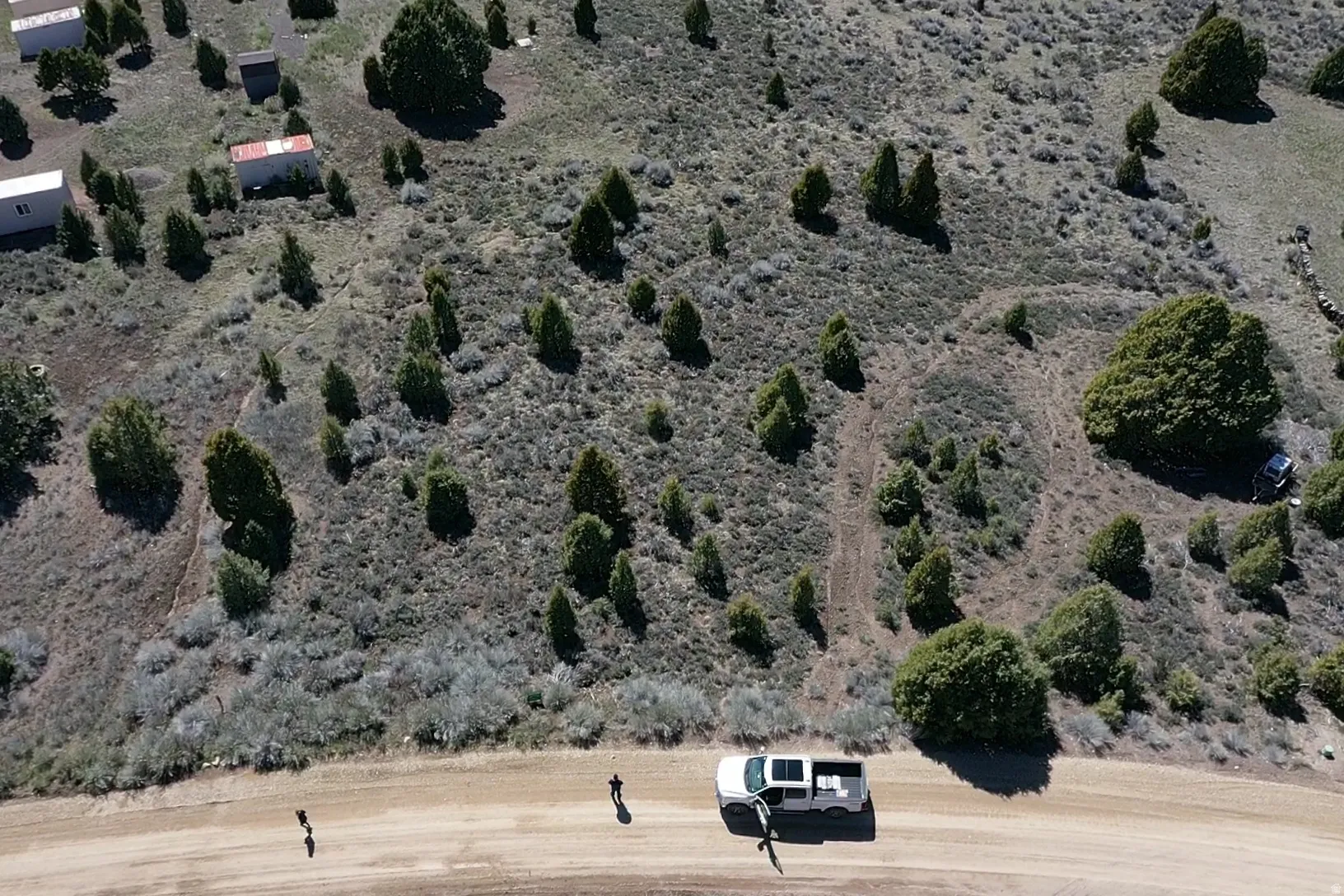 Aerial view of property and surrounding area featuring rural landscape