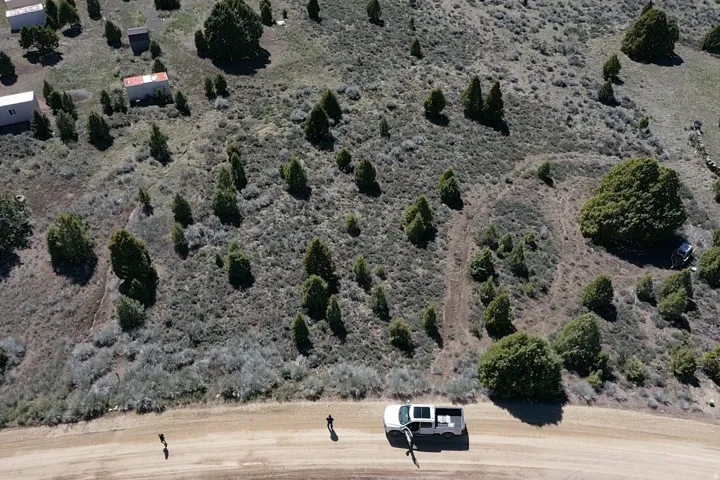 Aerial view of property and surrounding area featuring rural landscape