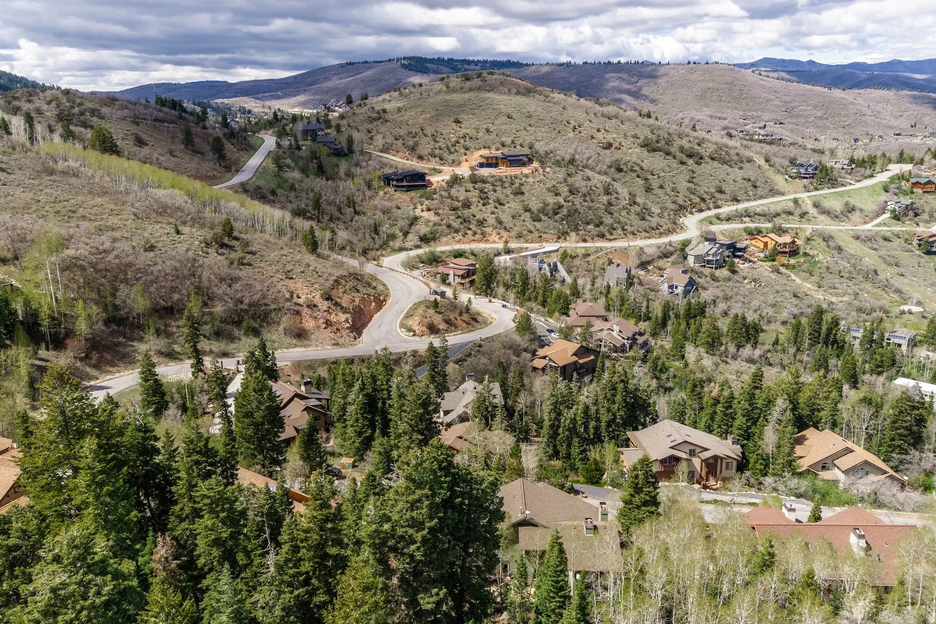 Expansive mountainous terrain with varied topography and natural vegetation