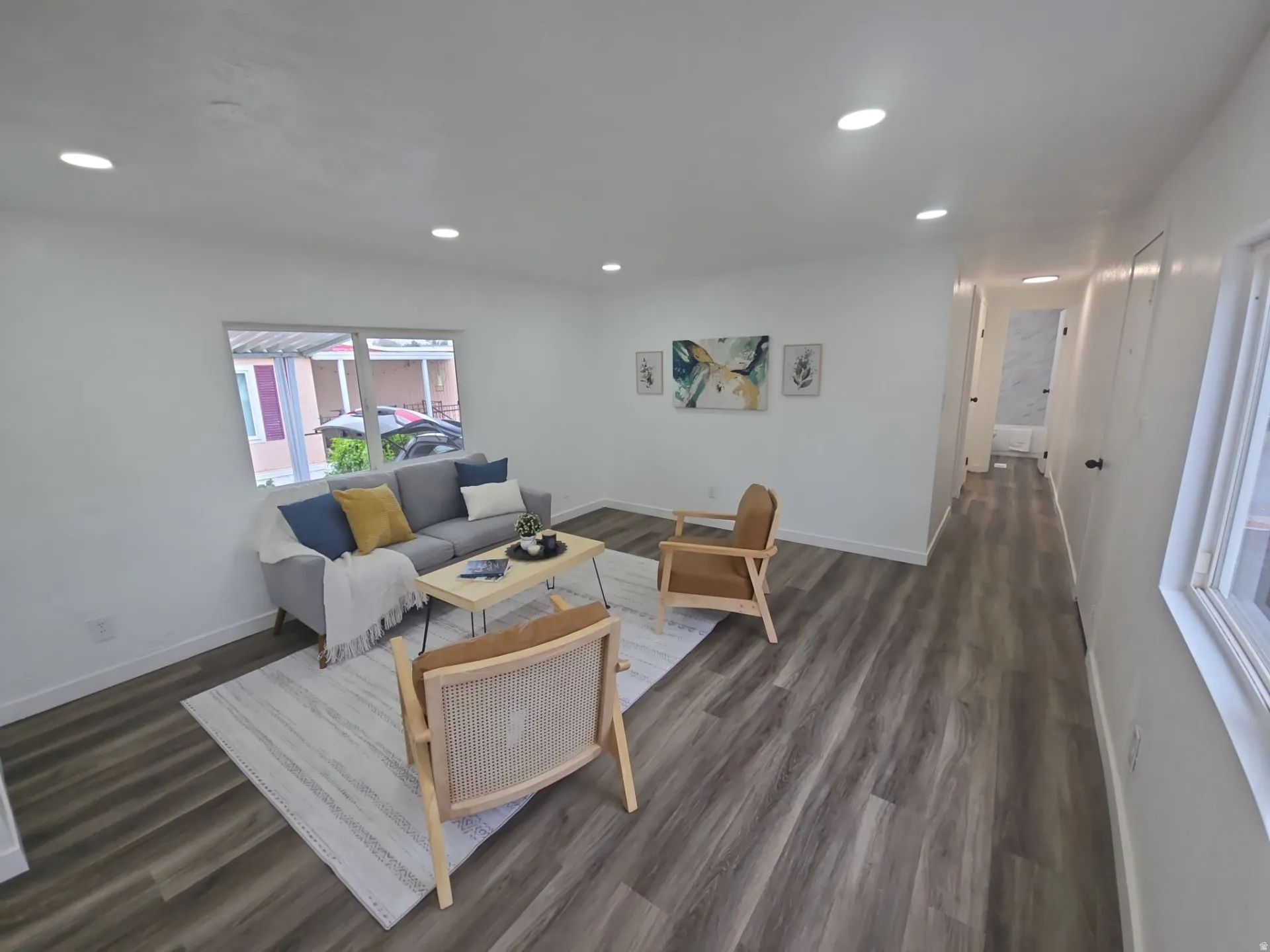 Living room featuring dark wood finished floors and recessed lighting