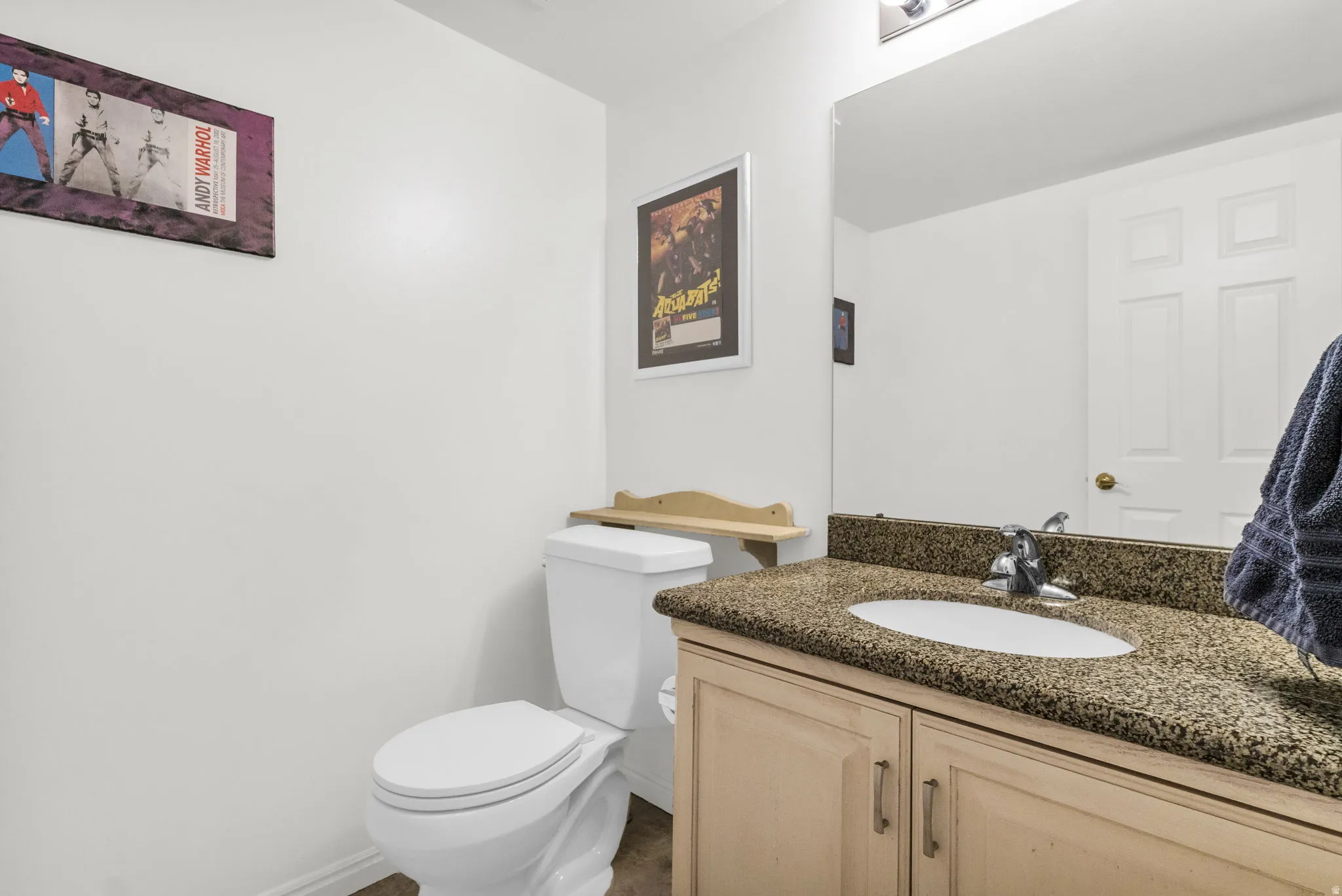 Powder Room off of front entry, kitchen, and garage