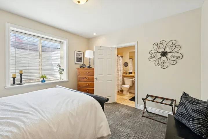 Bedroom featuring ensuite bath and recessed lighting