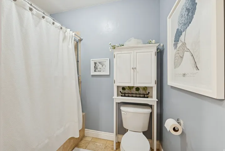Bathroom featuring toilet and baseboards
