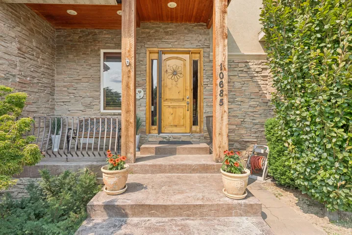 Property entrance with stone siding