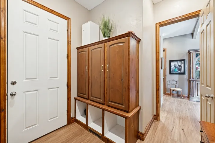 Mudroom featuring light wood-style floors
