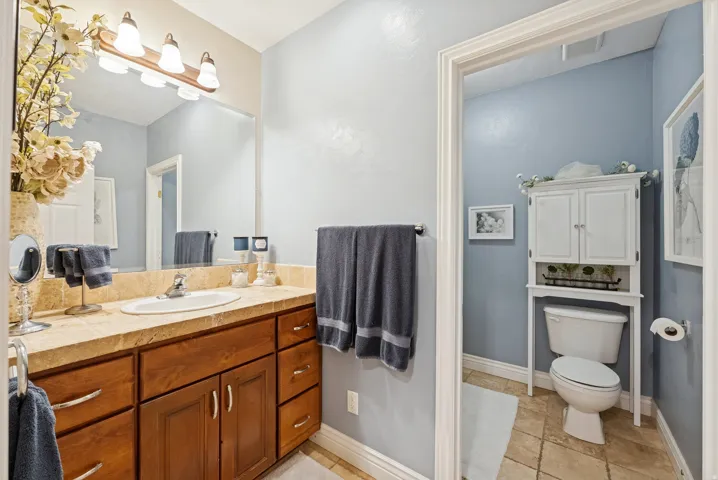 Full bathroom with vanity and toilet