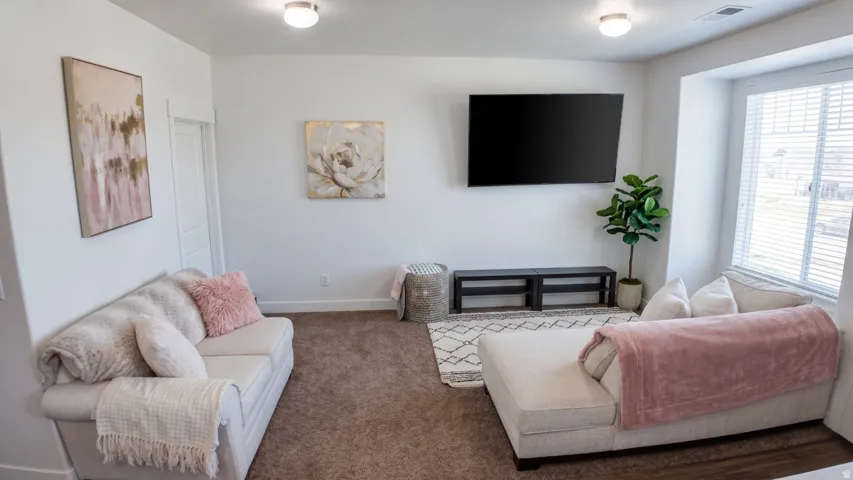 Living room with carpet and baseboards