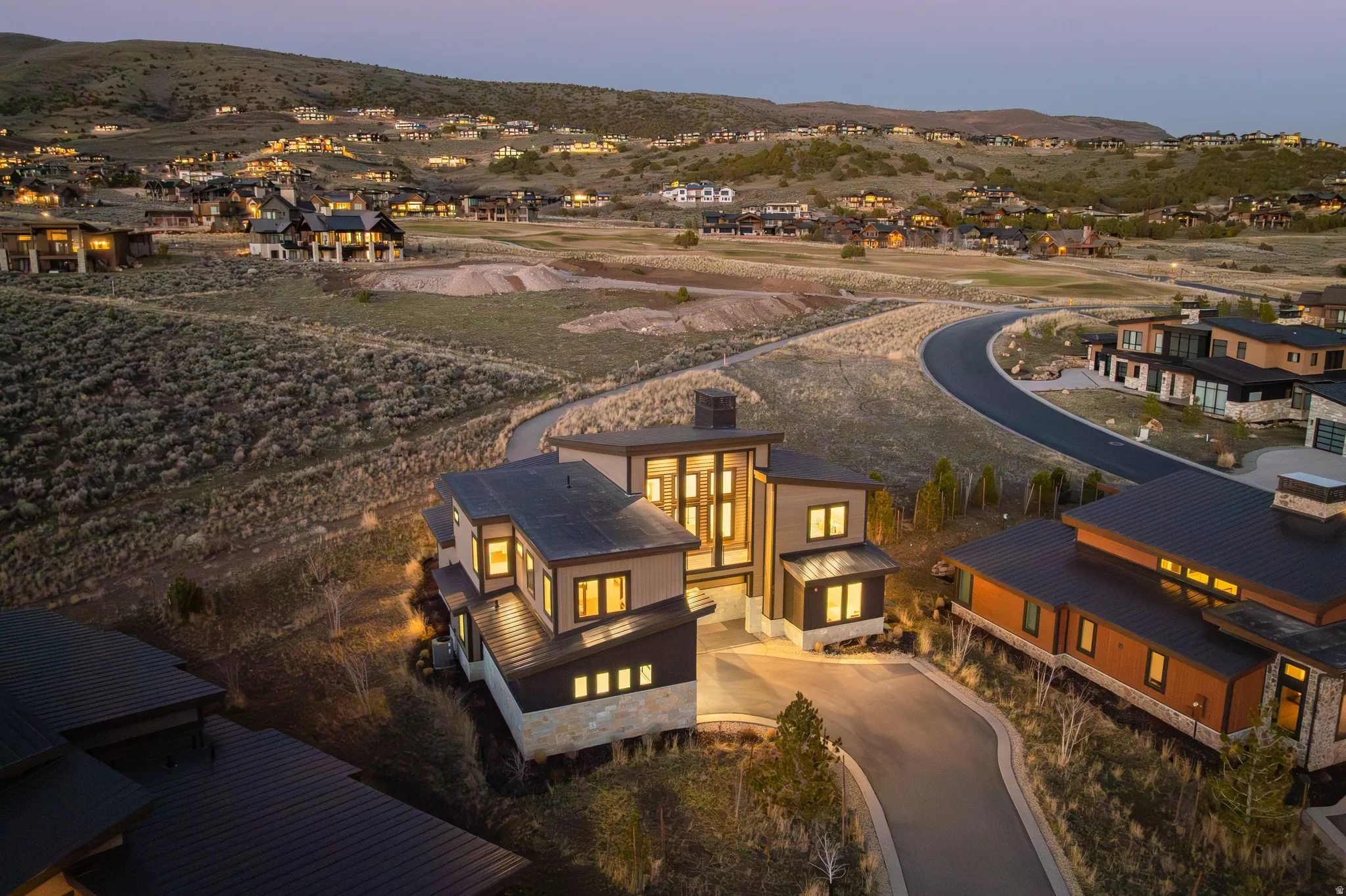 Aerial perspective of suburban area featuring a mountainous background
