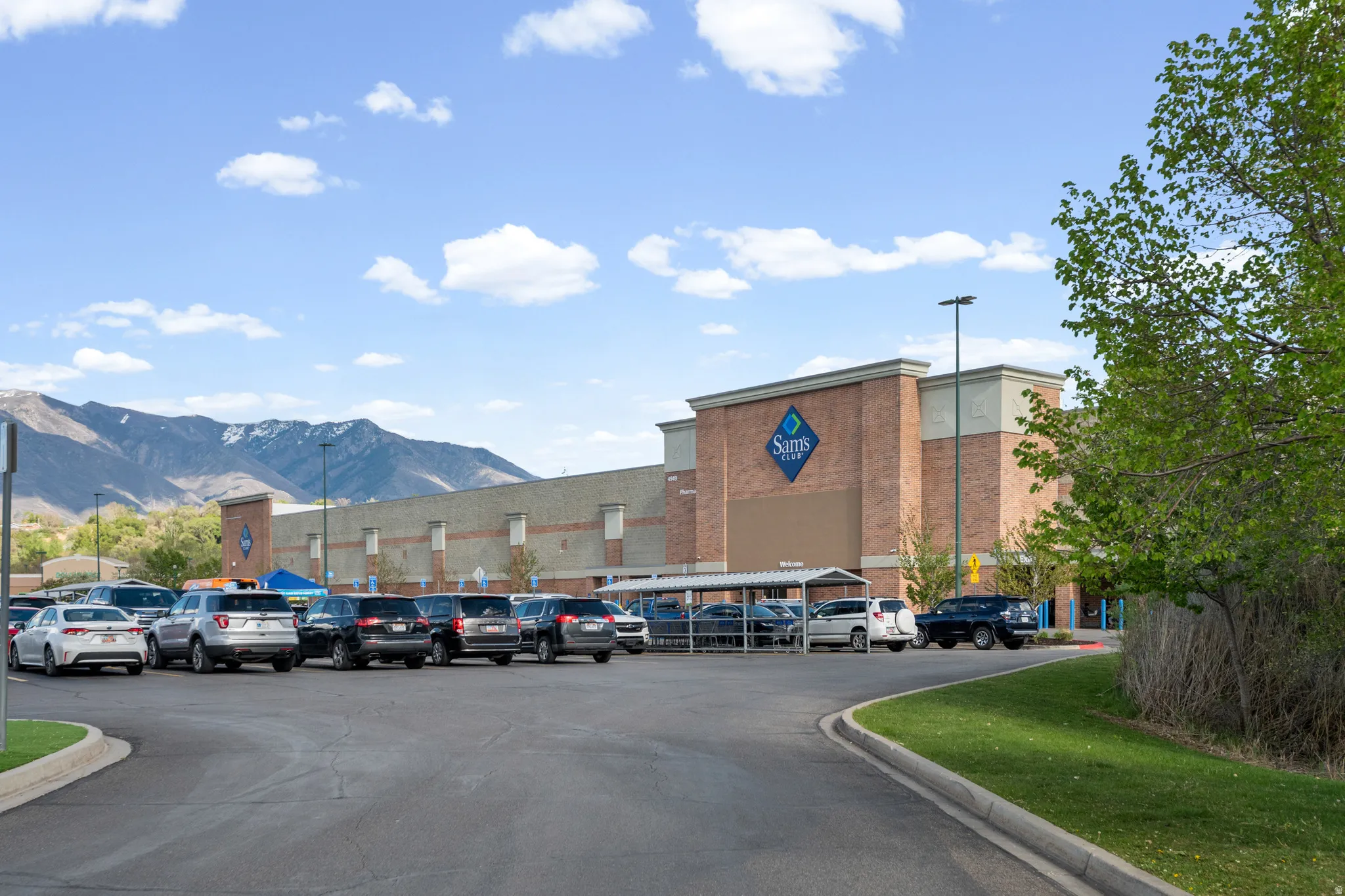 View of road featuring street lighting, curbs, and a mountain view