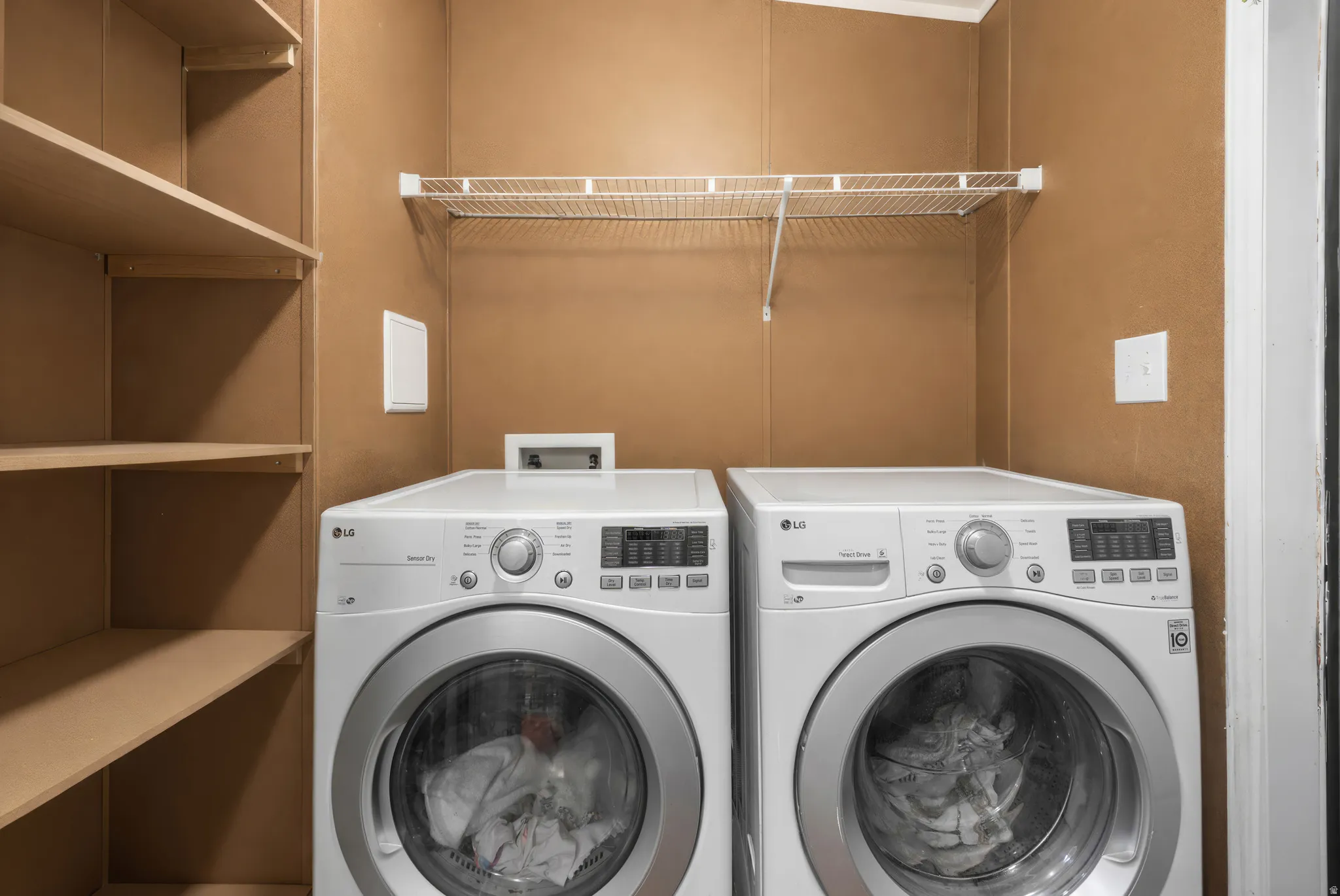 Laundry area featuring washing machine and clothes dryer