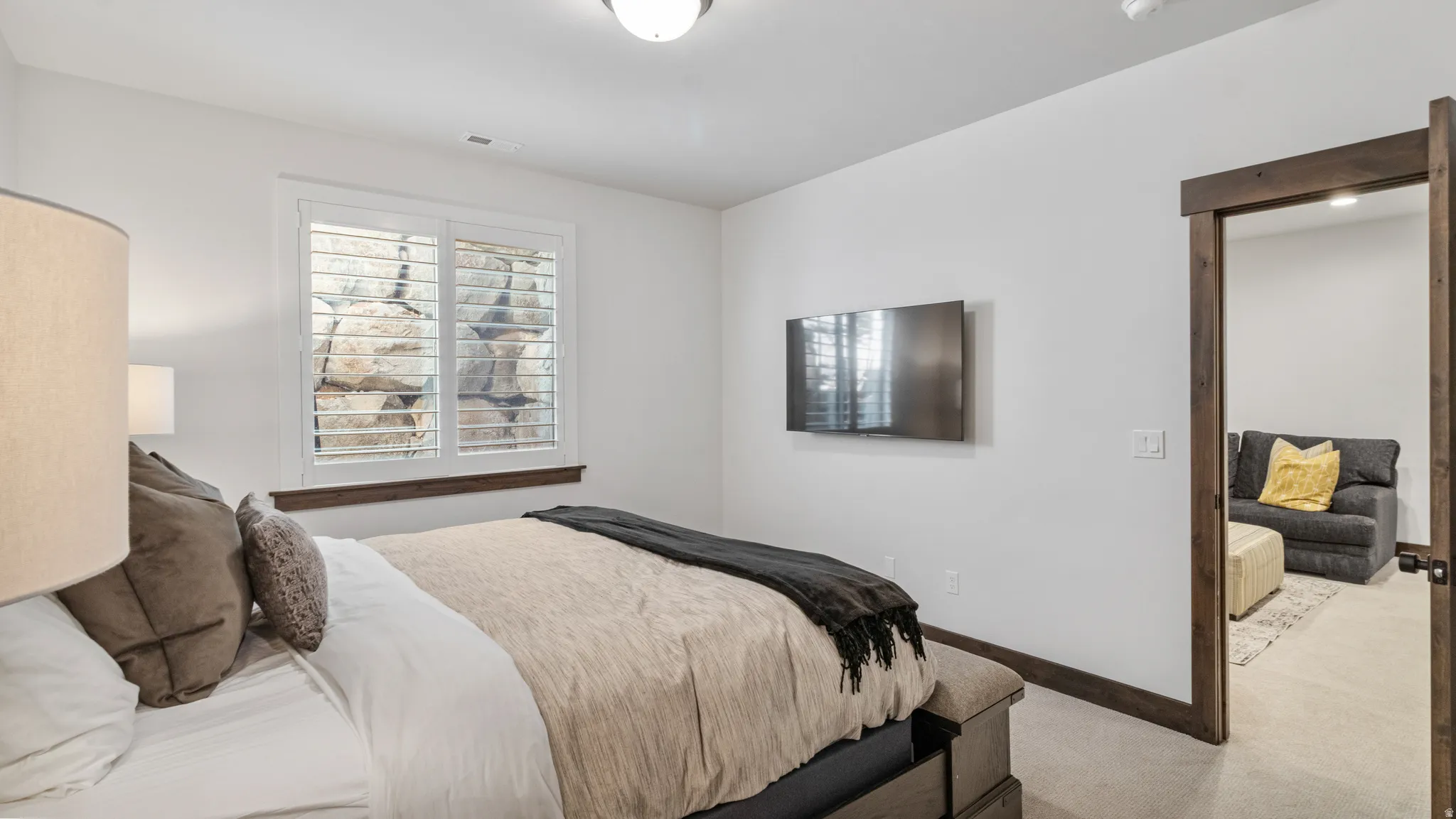 Bedroom featuring carpet flooring and baseboards