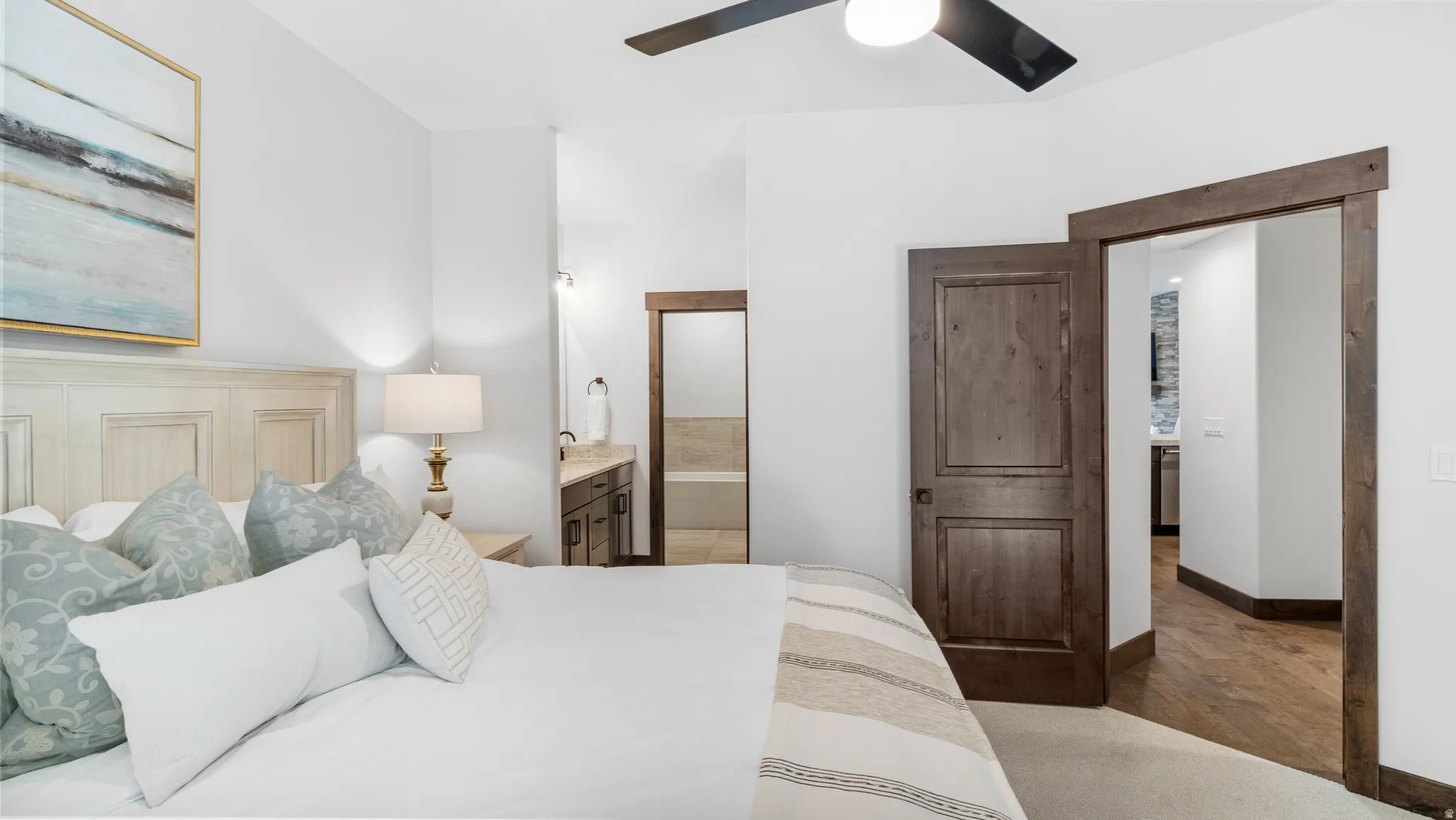 Bedroom with ensuite bathroom and ceiling fan