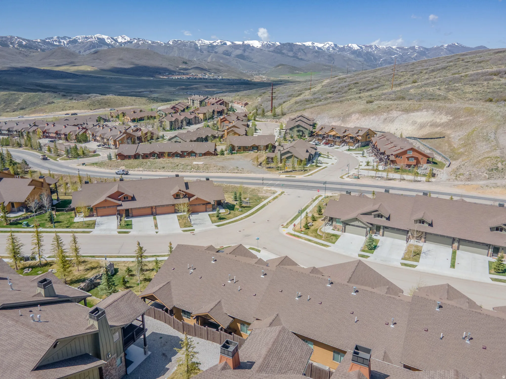 View of property location featuring a mountain backdrop and nearby suburban area