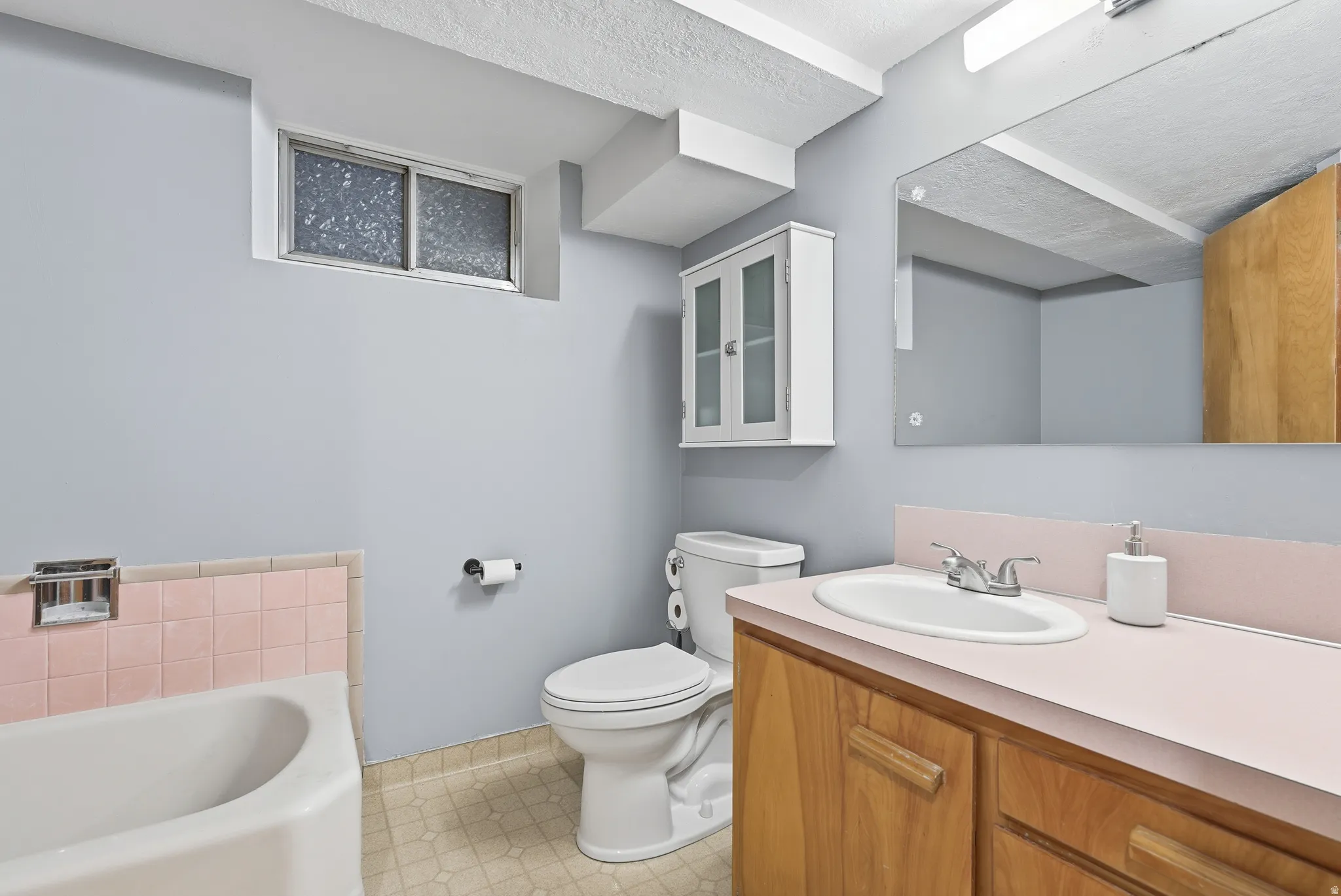 Full bath with a bath and vanity