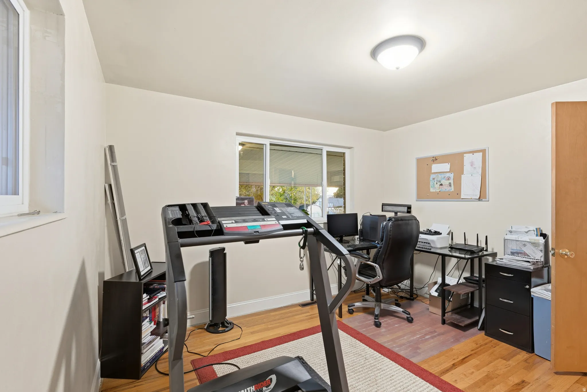 Office featuring light wood-type flooring and baseboards