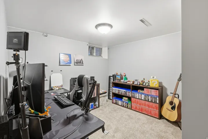 Office featuring light colored carpet