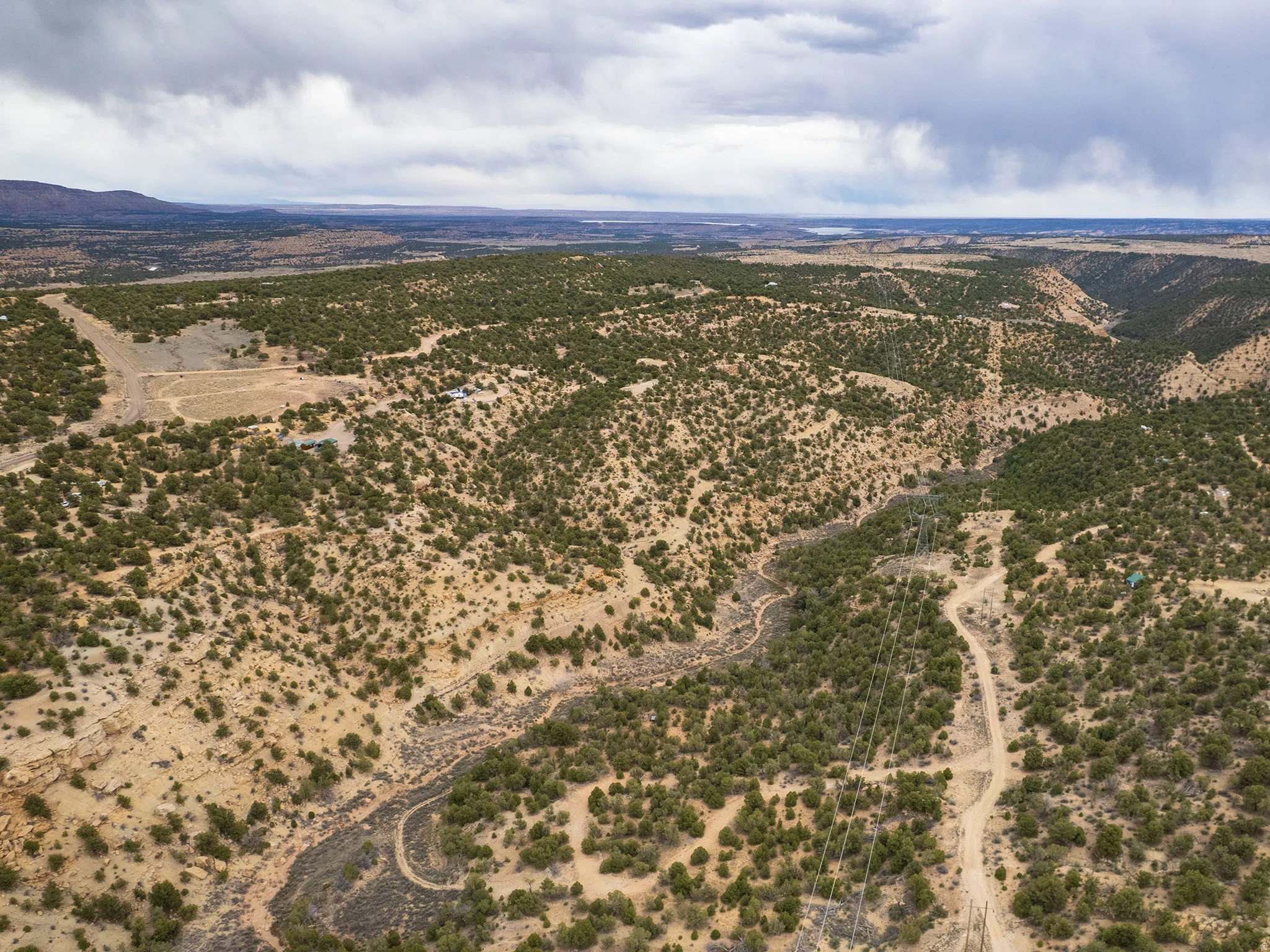 Overview of rural landscape with a desert landscape and a mountain backdrop