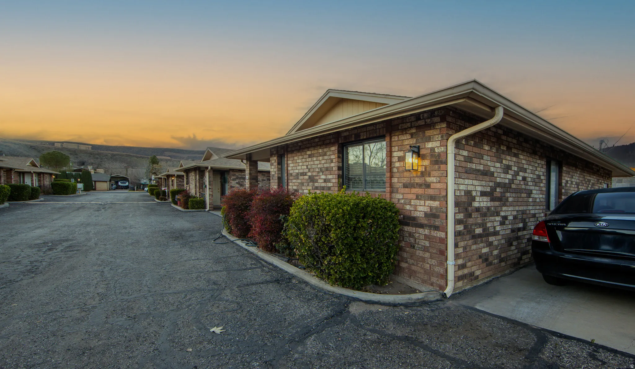 View of property exterior featuring brick siding