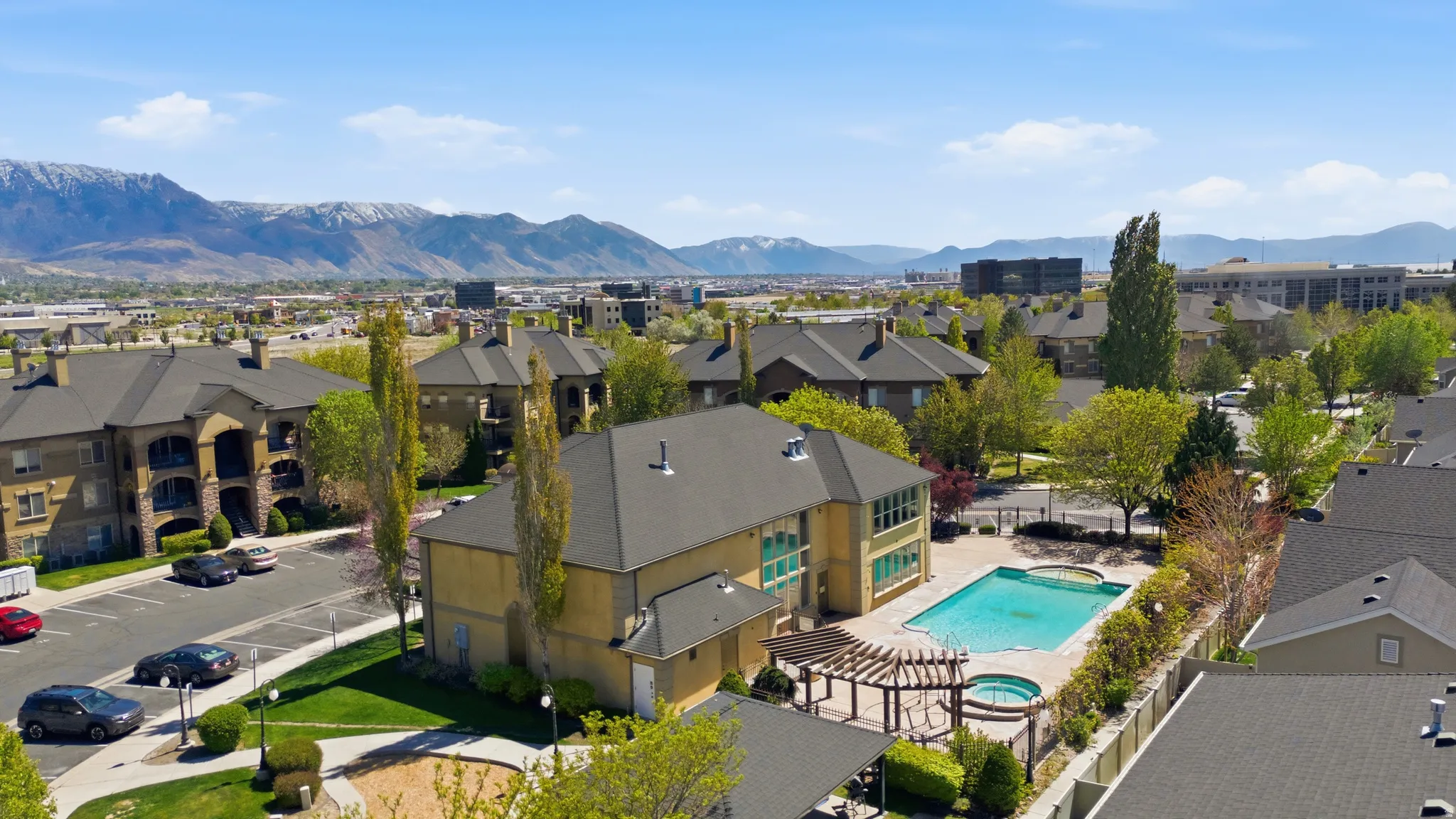 Aerial perspective of suburban area featuring a mountainous background
