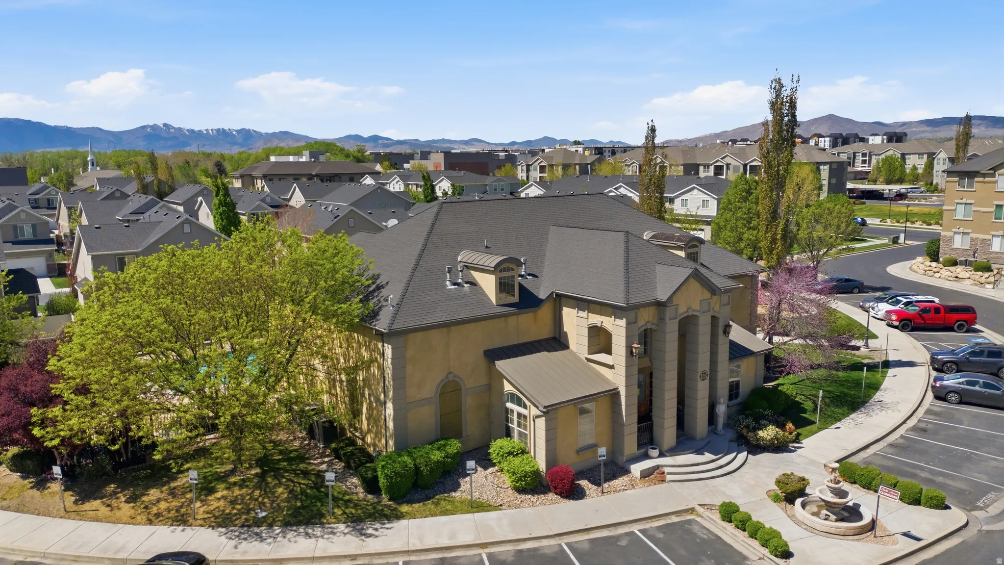 Aerial view of residential area featuring a mountain backdrop