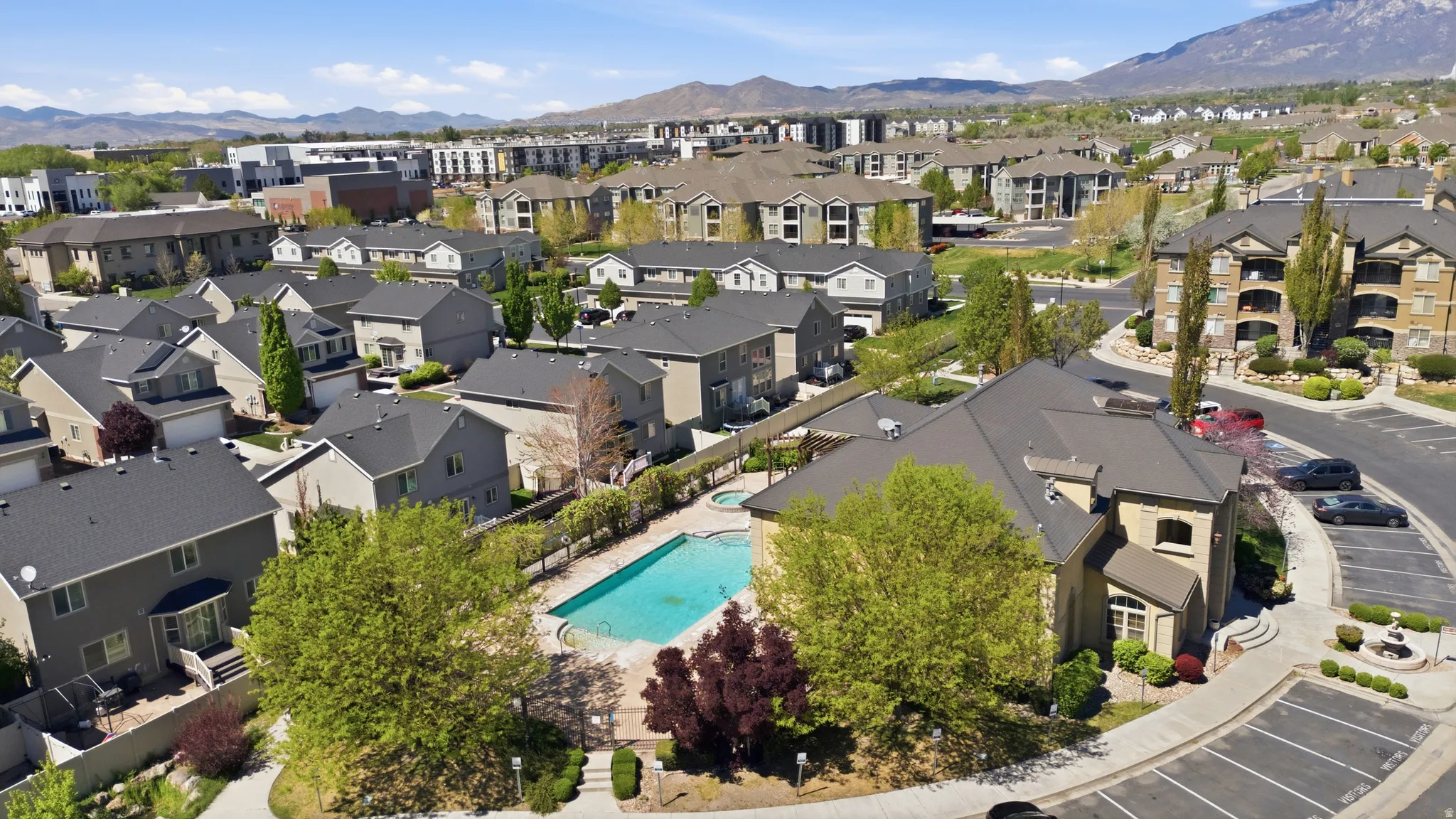 Aerial perspective of suburban area with a mountain backdrop