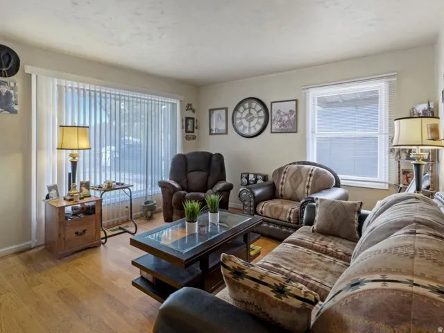 Living area with light wood finished floors and baseboards
